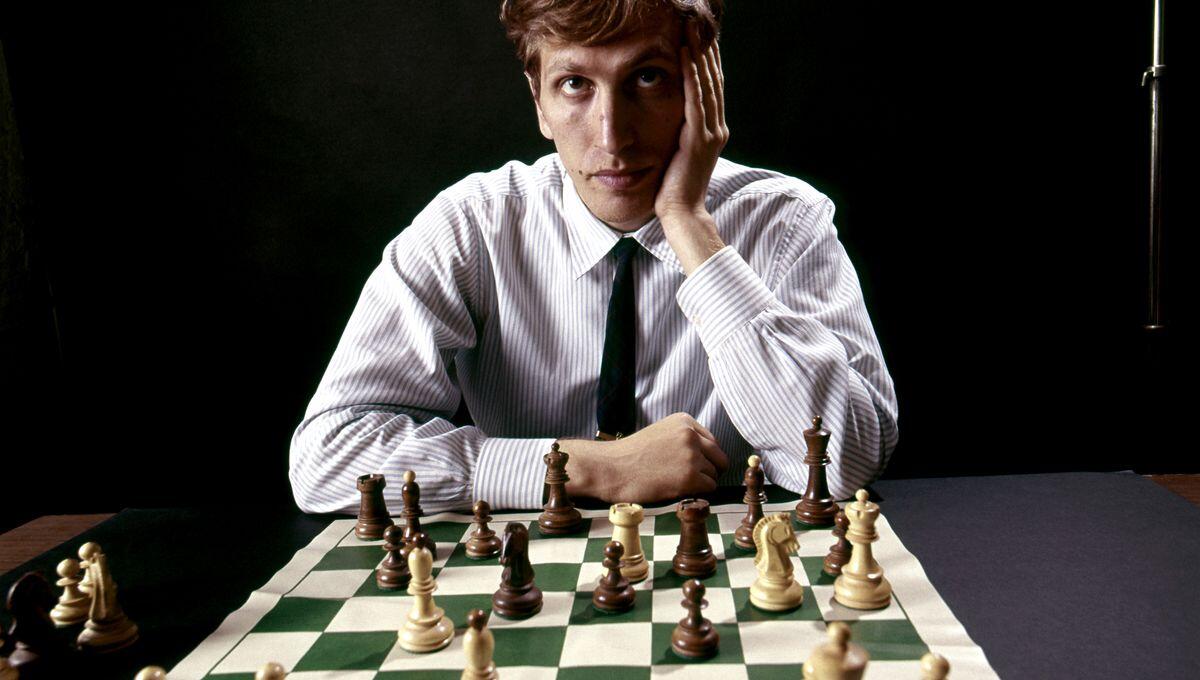 Bobby Fischer in front of chessboard