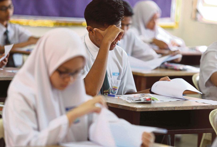 a male student thinking of an answer