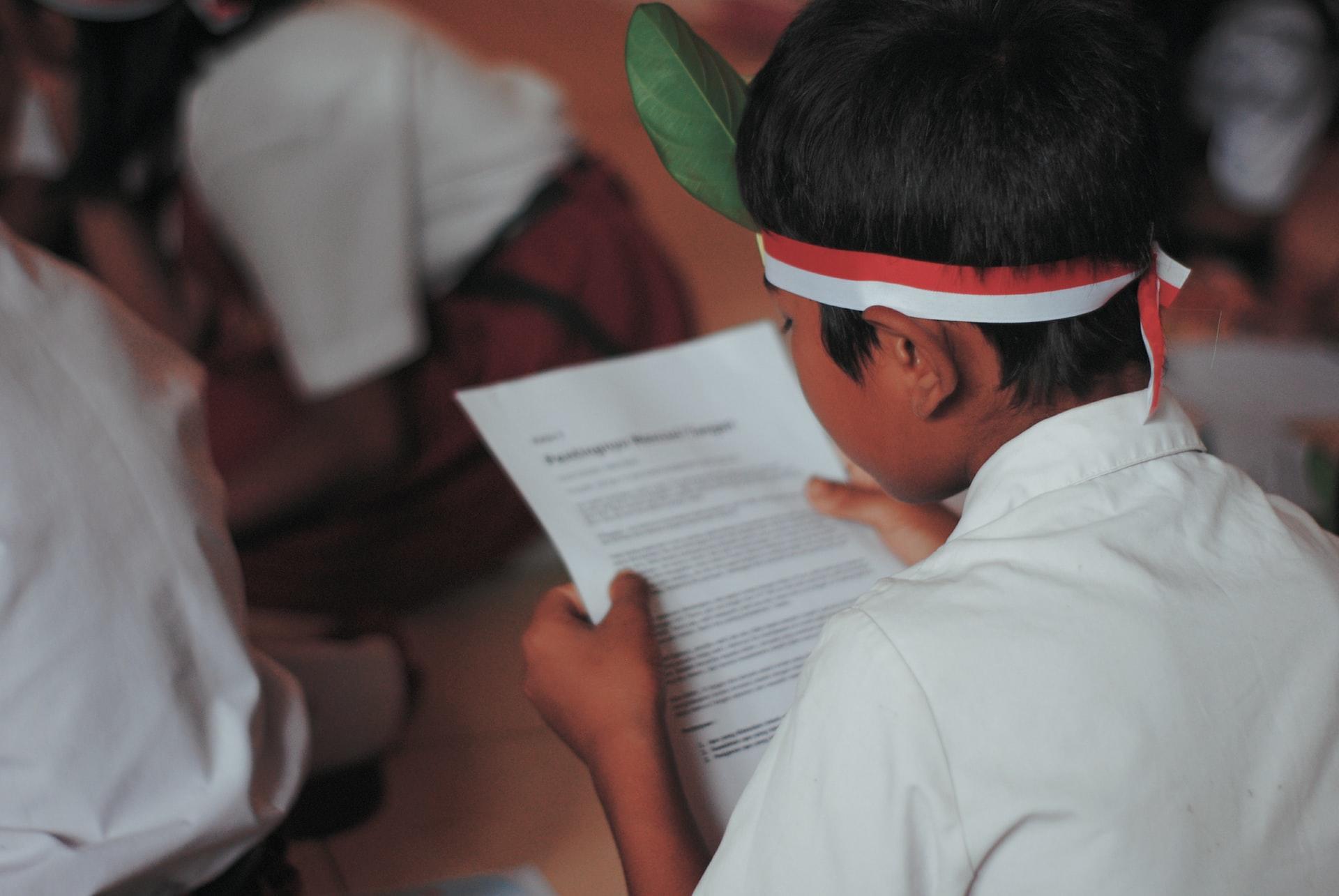 a school boy reading english
