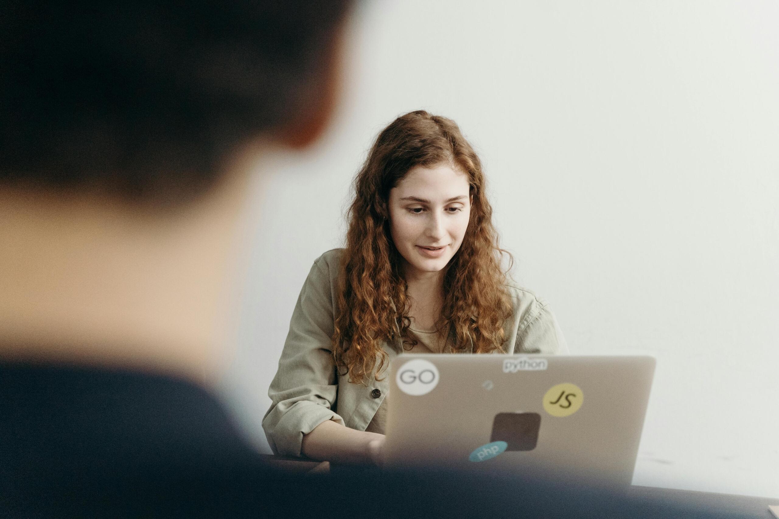 Woman sitting at laptop