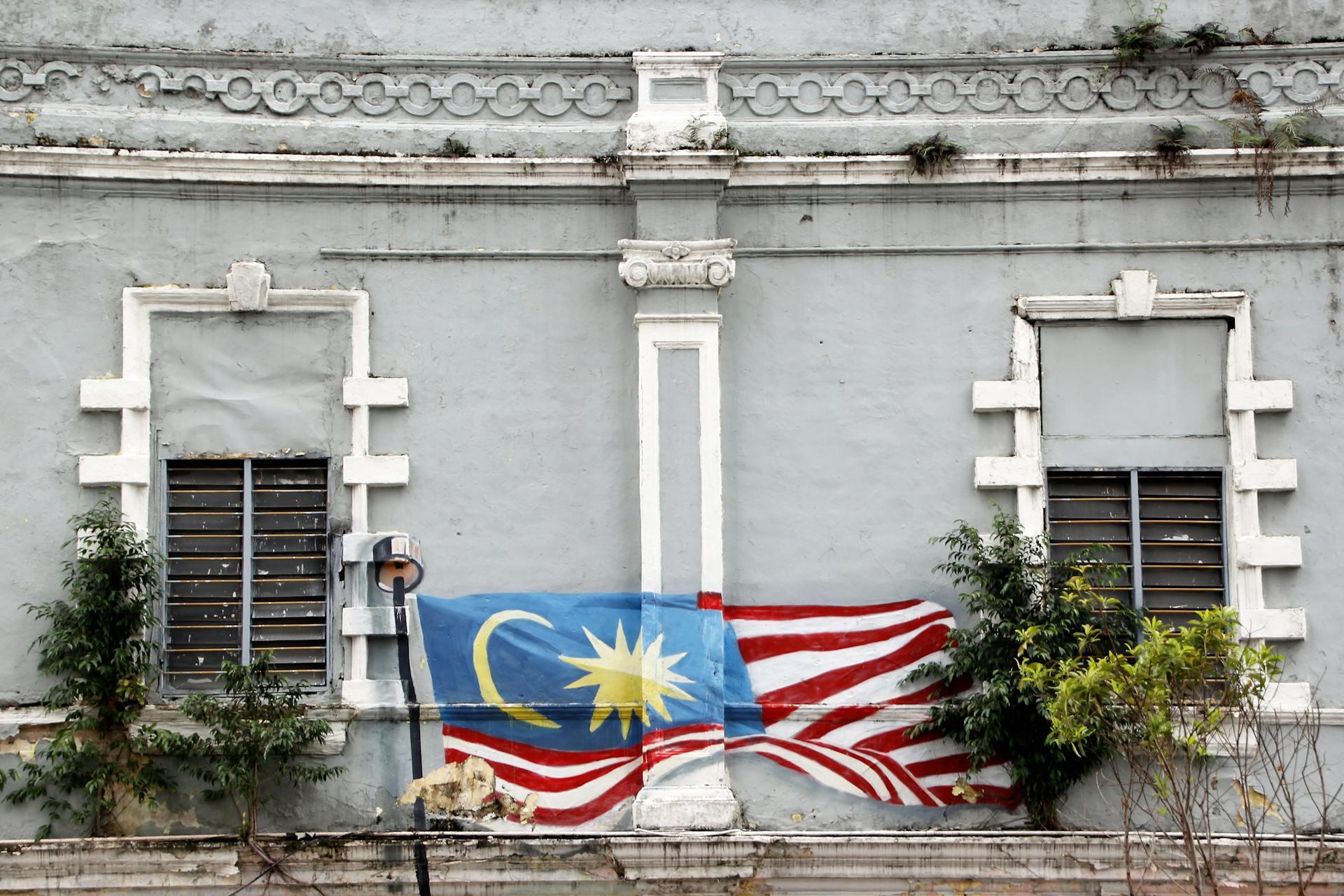 Malaysian flag mural on a wall.