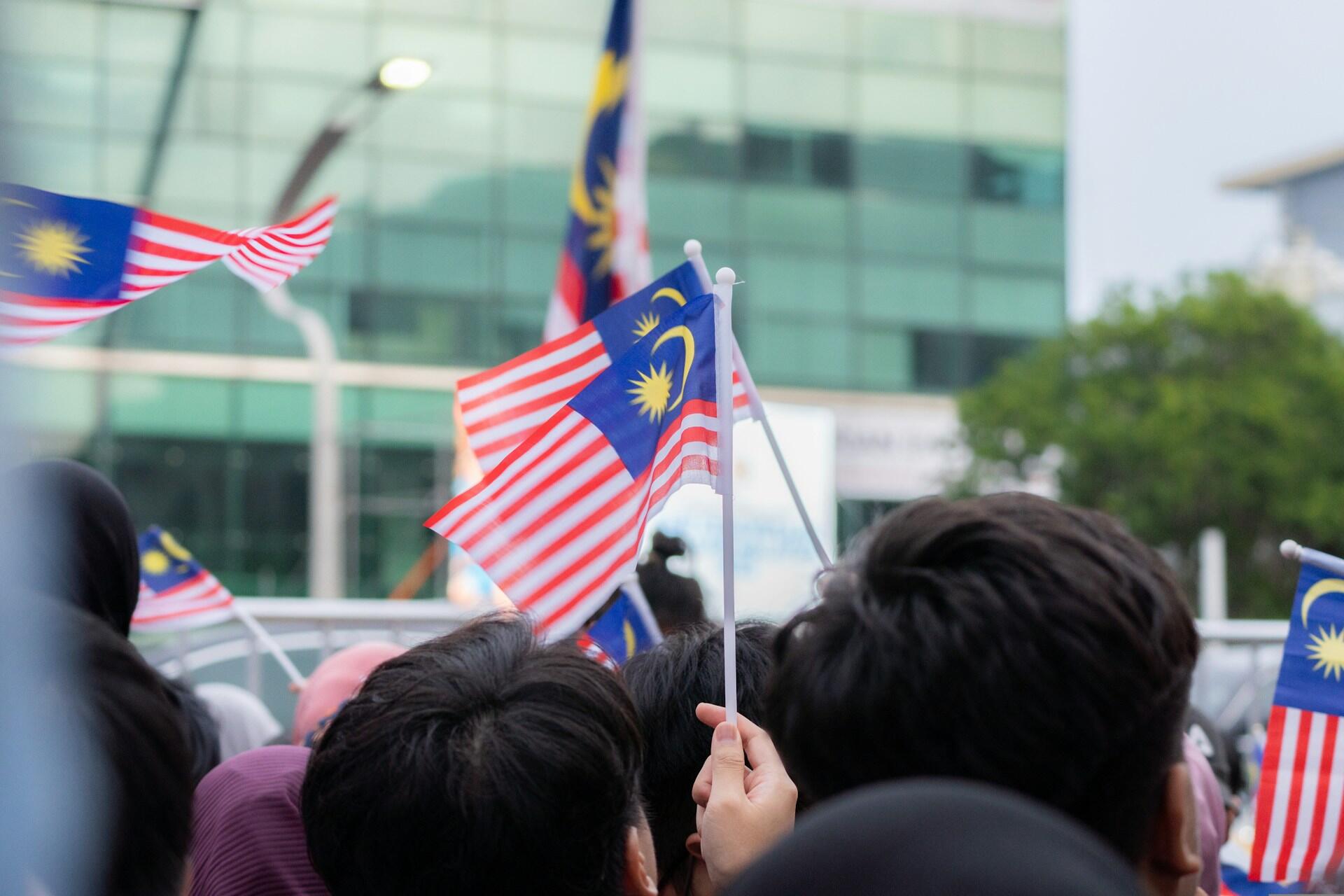 Jalur Gemilang flag being waved during the Malaysia Independence Day Parade in Putrajaya