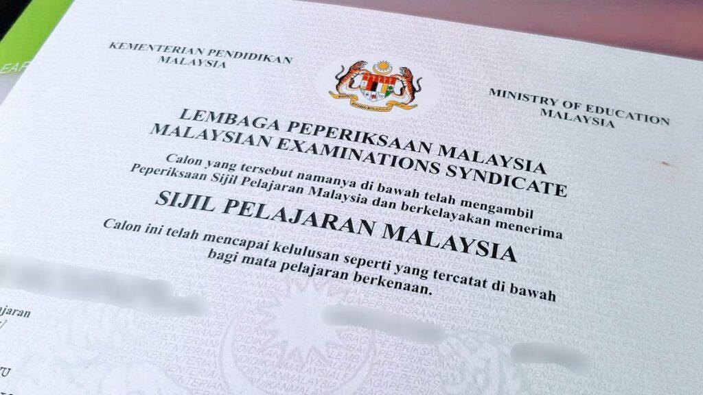 Close-up of the top part of an SPM certificate with official emblem and title