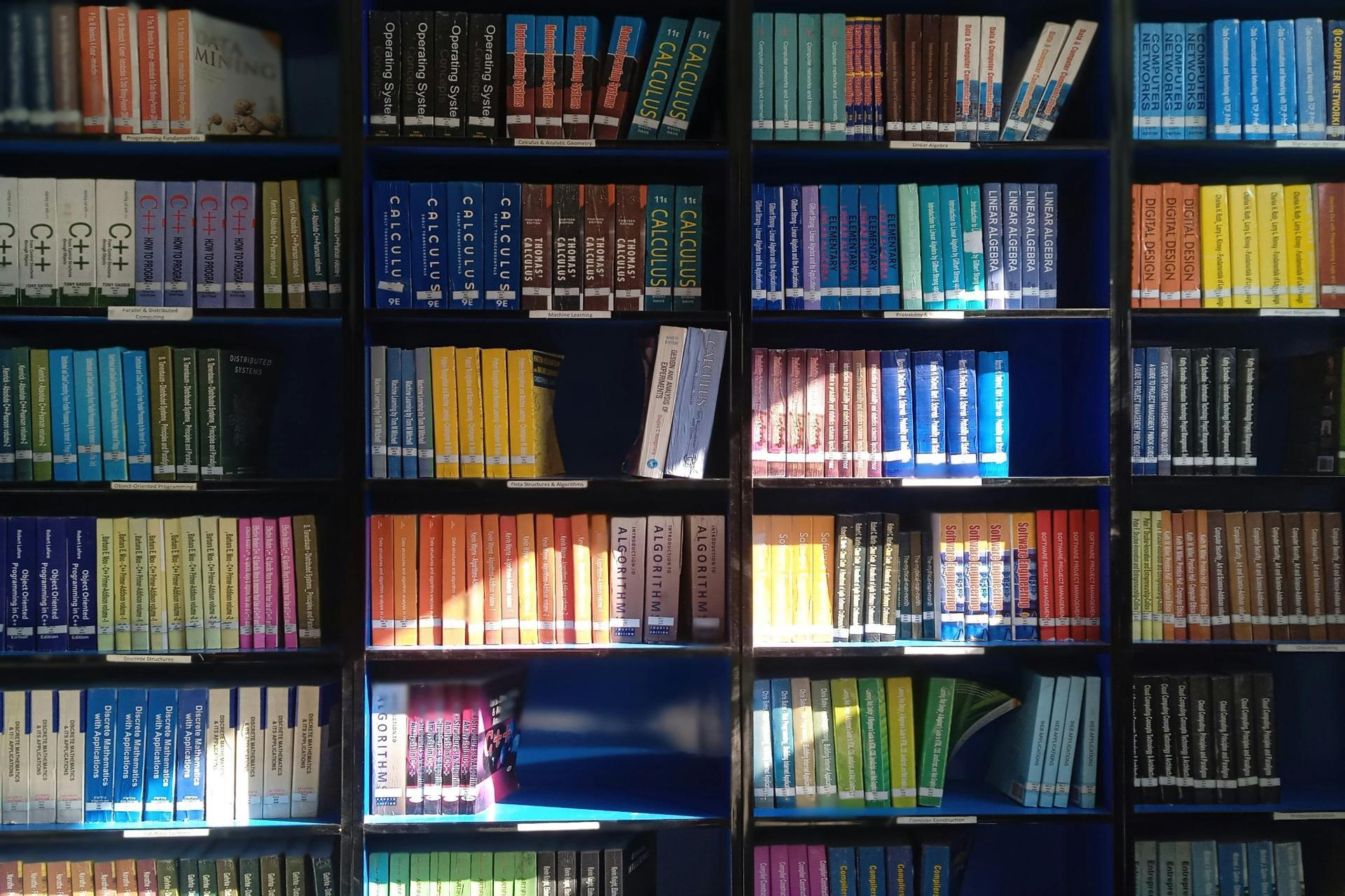 bookshelf filled with mathematics and academic reference books for study and exam preparation
