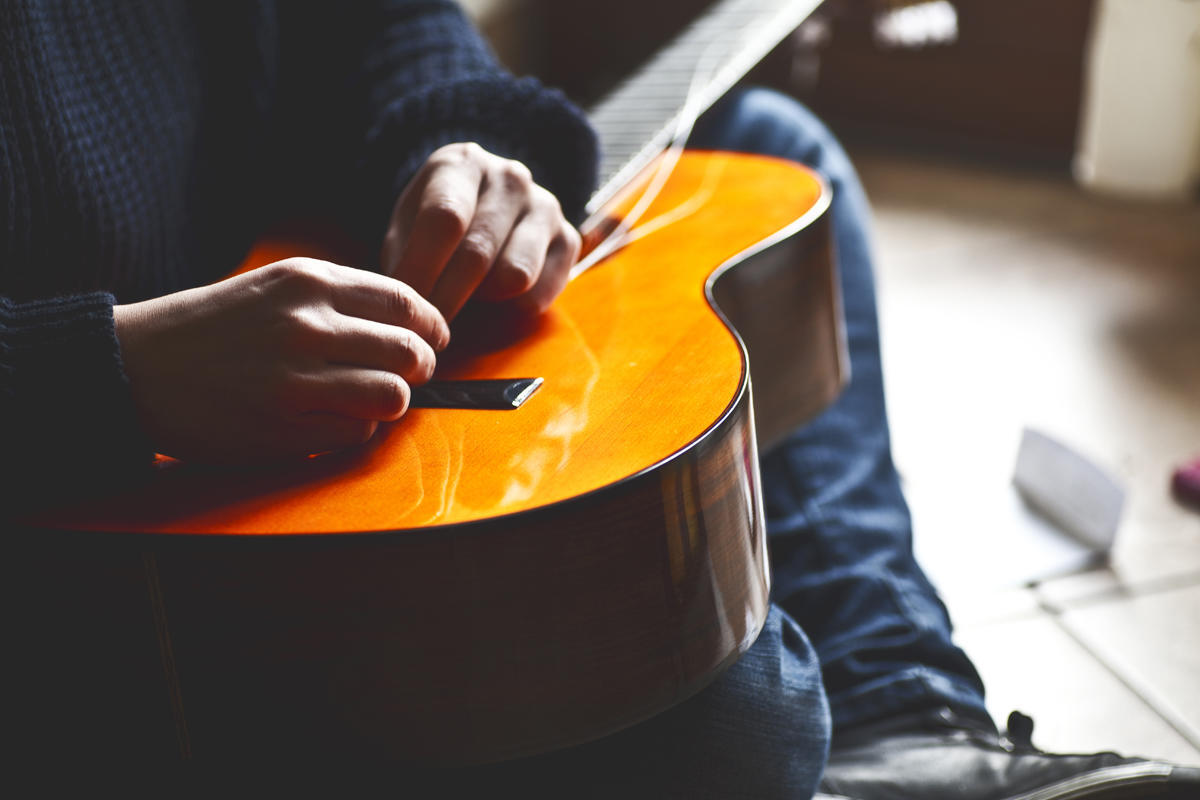 Someone changes their guitar strings.
