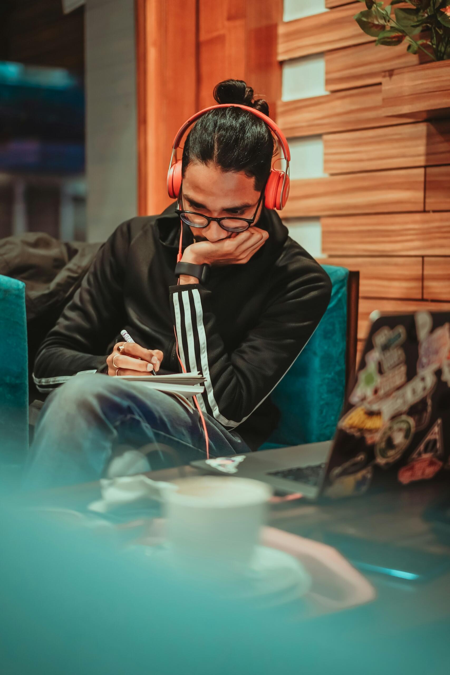 A young student wearing headphones
