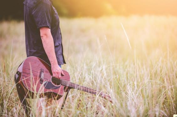 A guitarist not practicing in a field