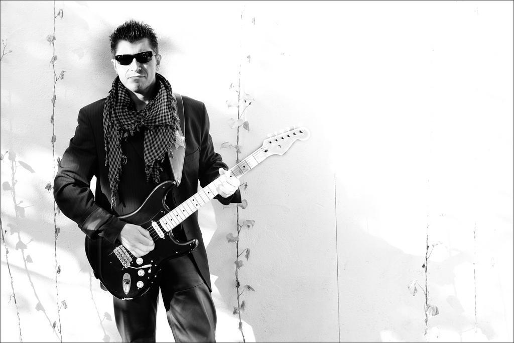 a man playing the electric guitar