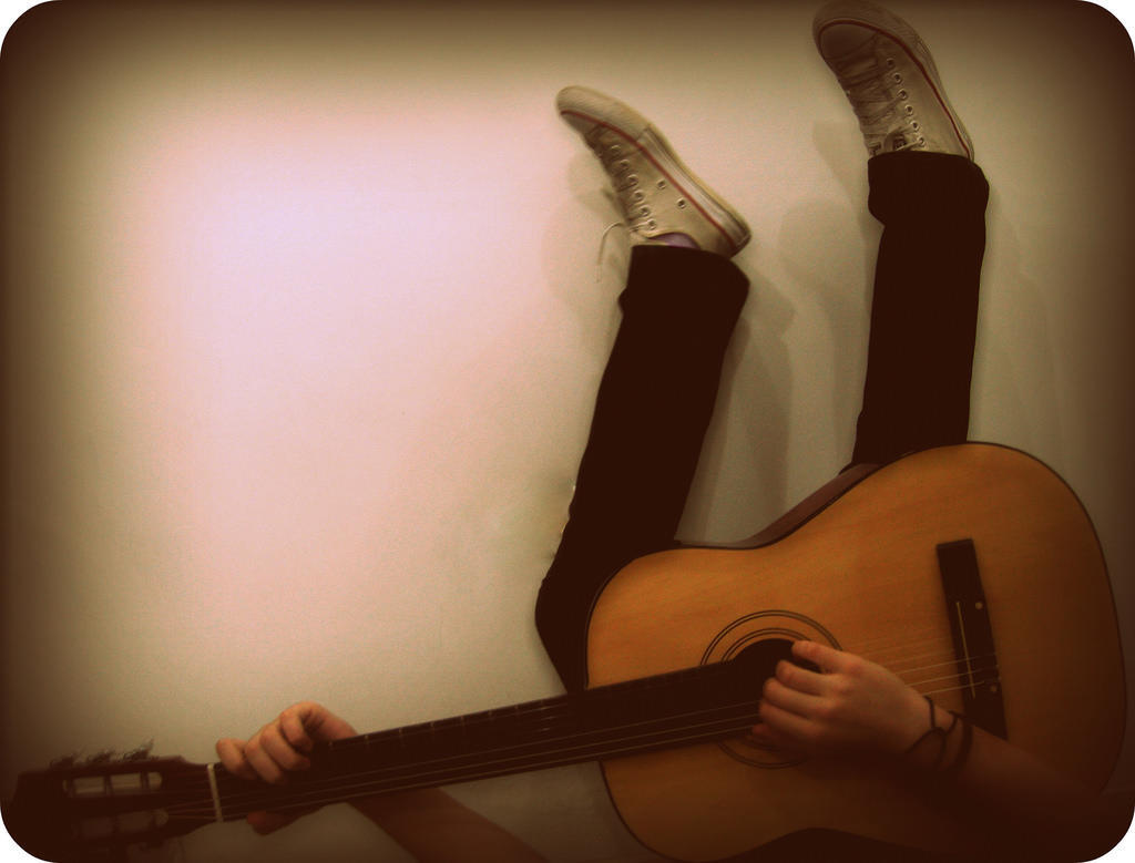 playing guitar upside down is a skill