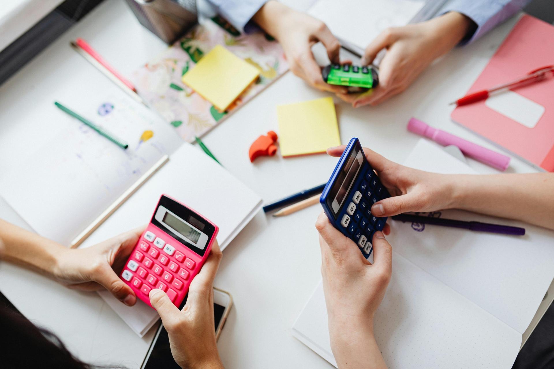 students using calculators and studying together in a group for SPM Mathematics preparation