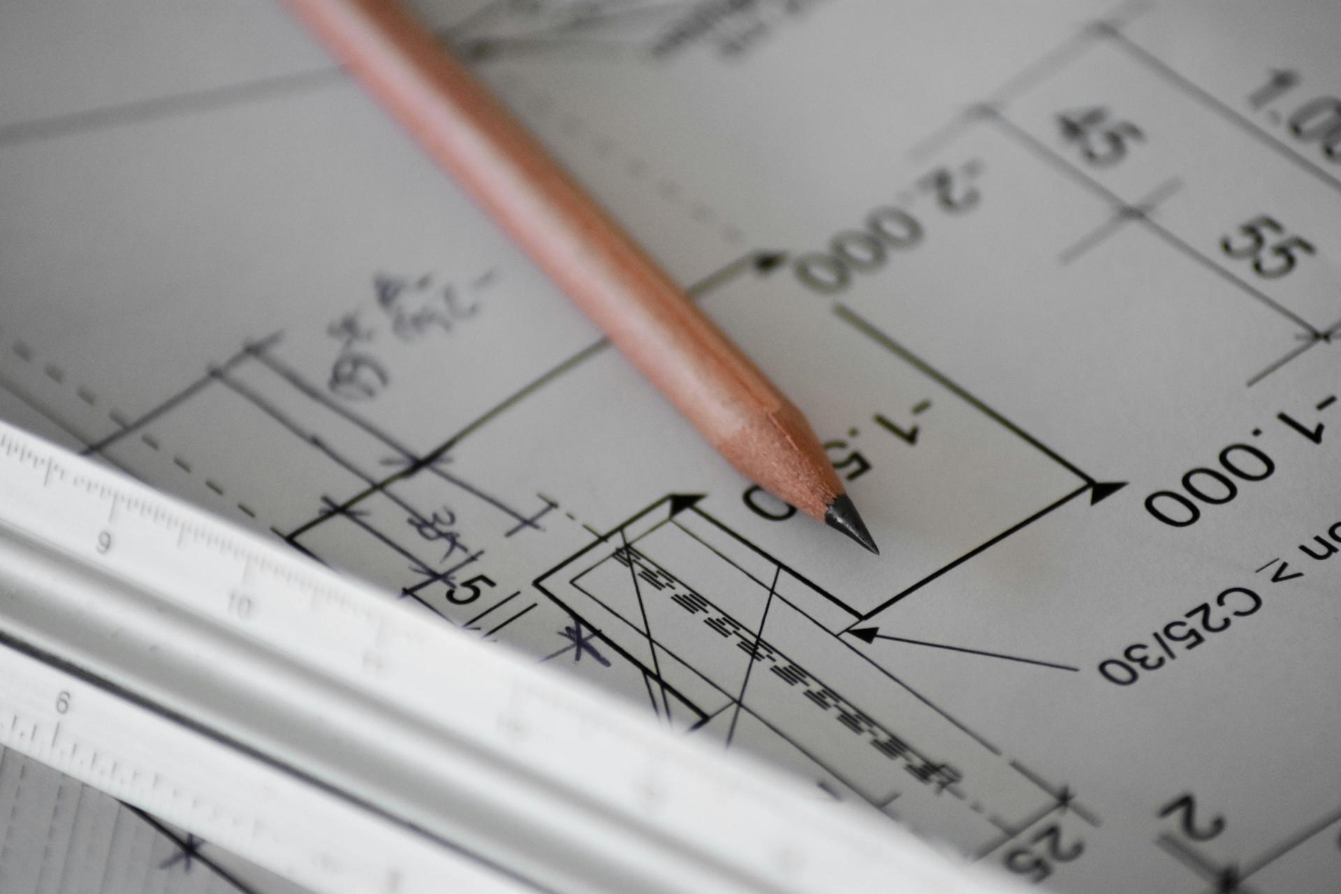 Technical drawing with pencil and measurements representing geometry concepts in SPM Mathematics