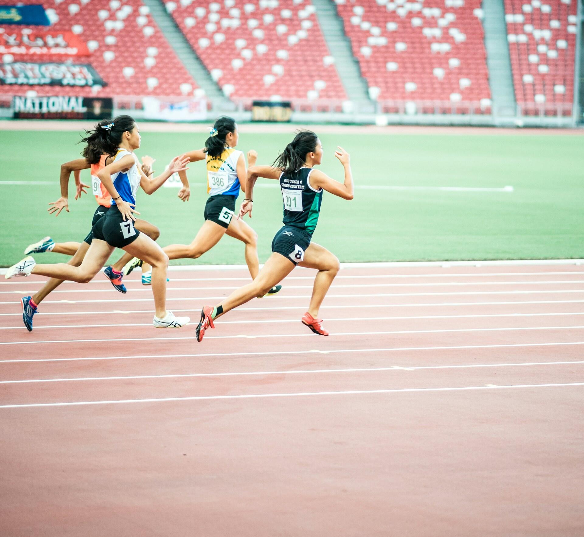 runners sprinting on a track