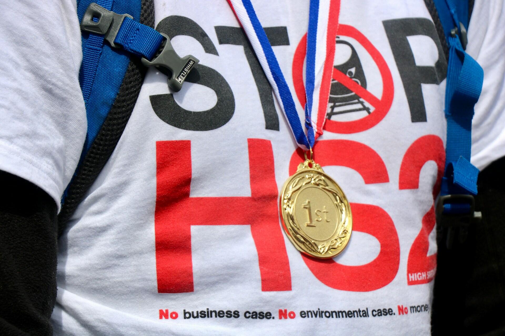 a picture of a gold medal over a tshirt
