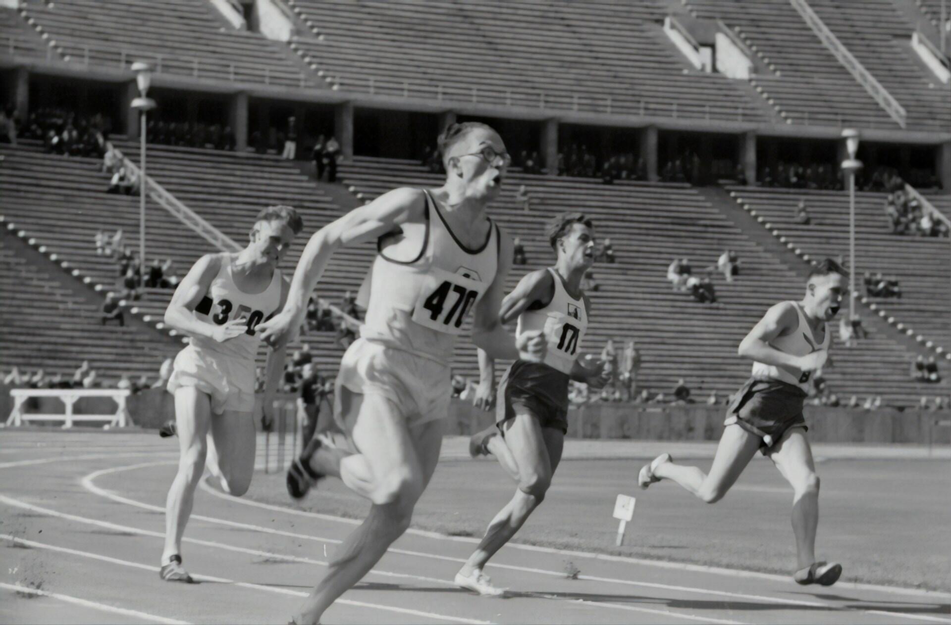 A black and white picture of runners running