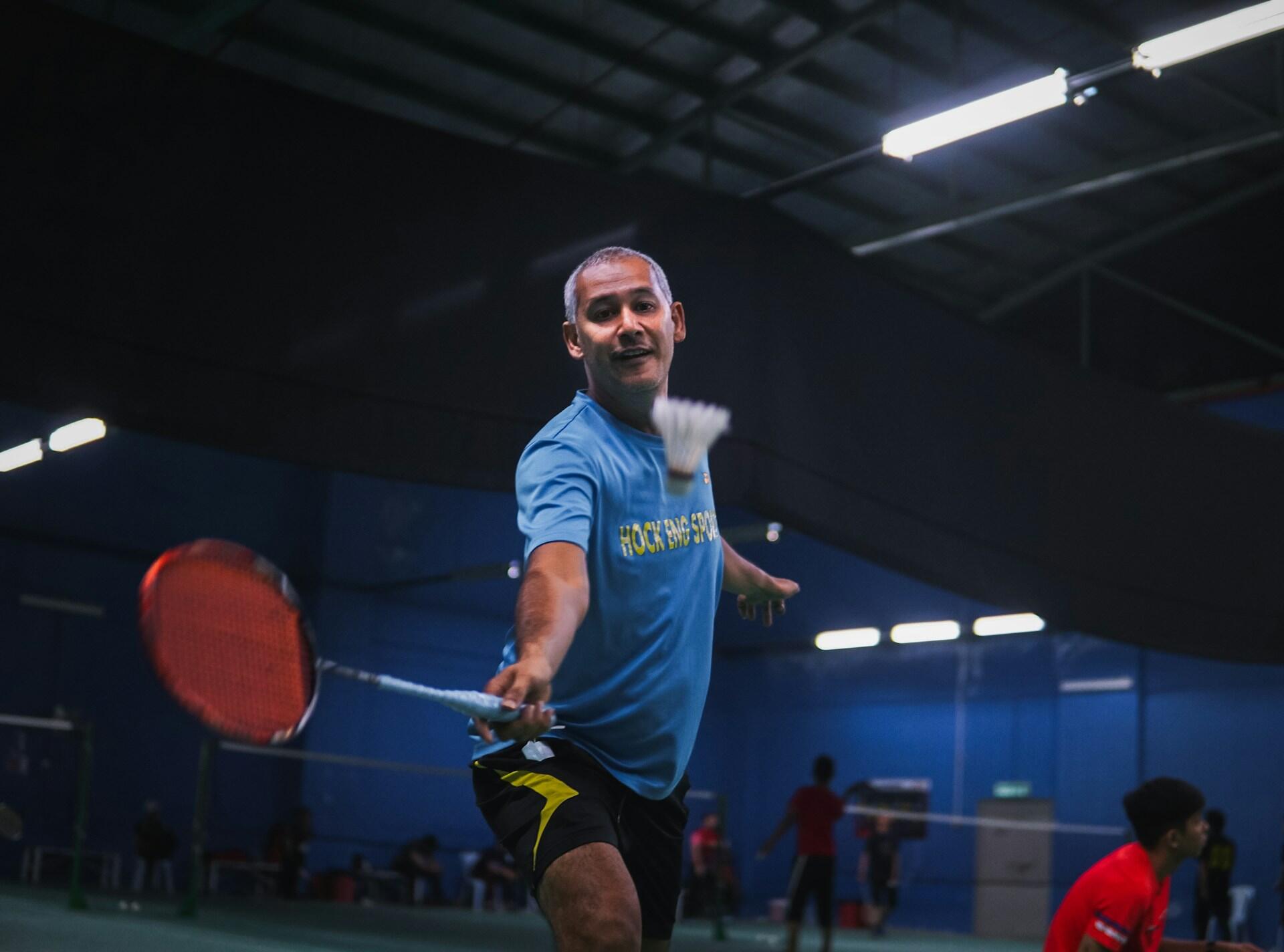 A man plays badminton
