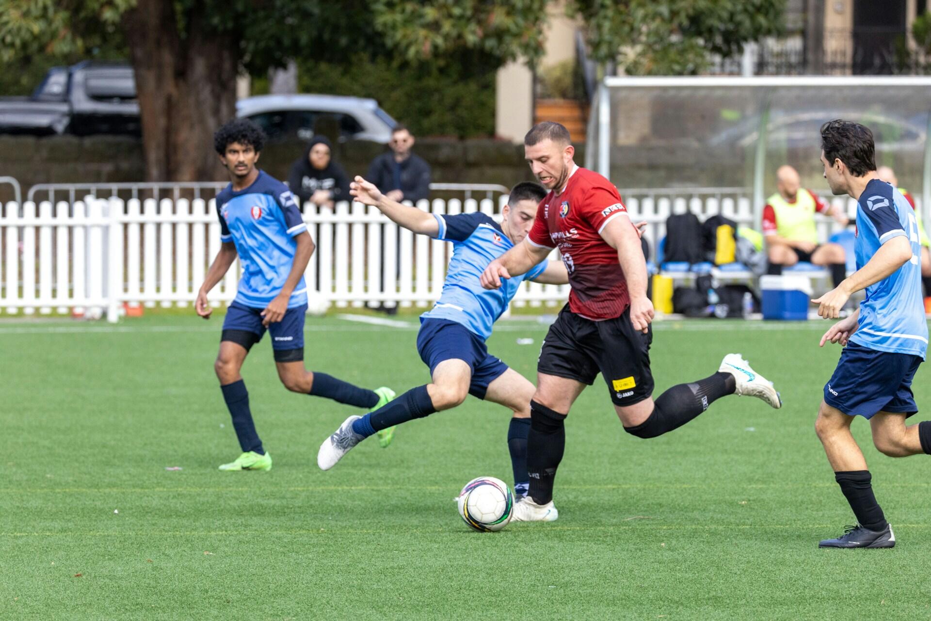 A group of players playing football