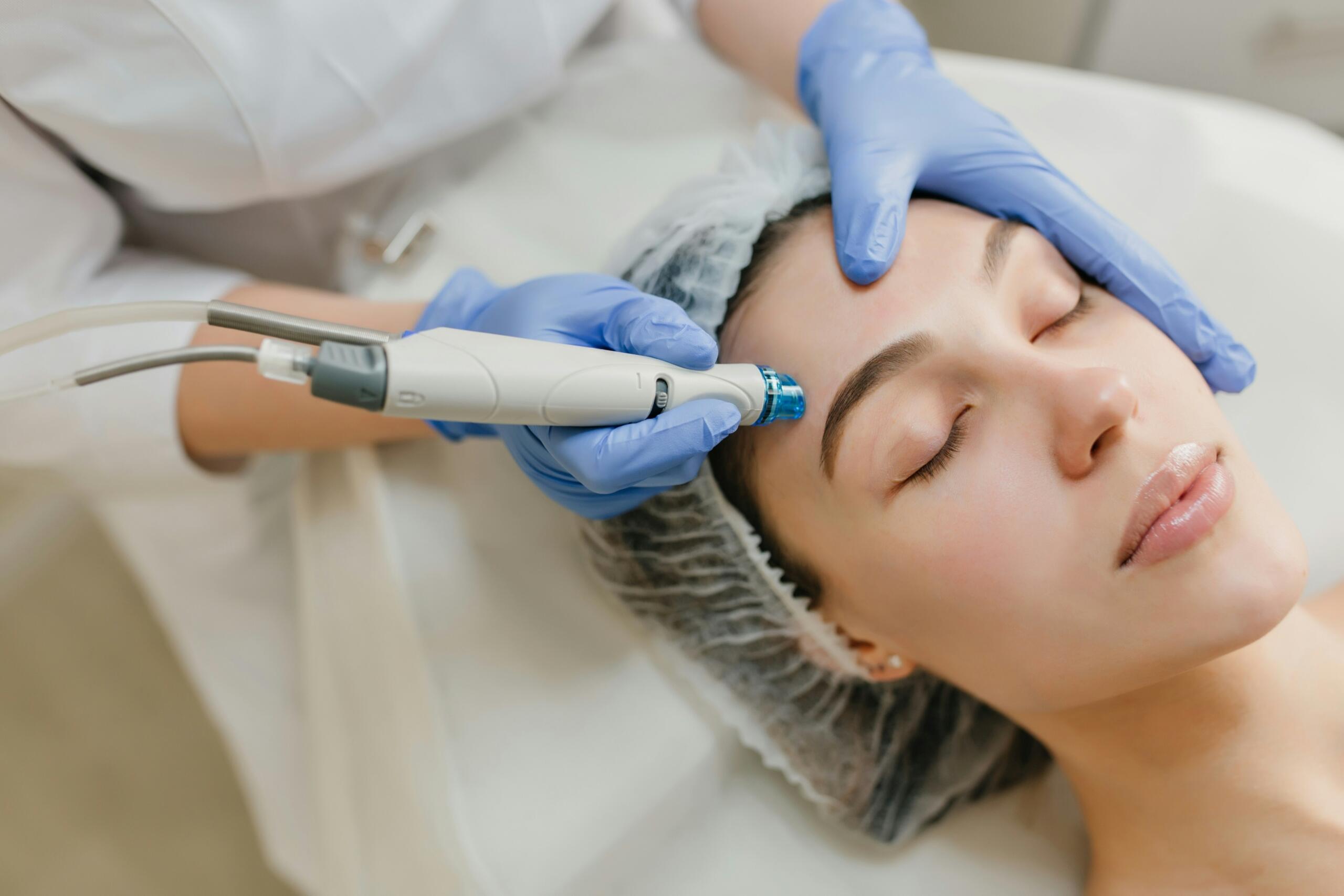An overhead shot of a woman getting a facial peel.