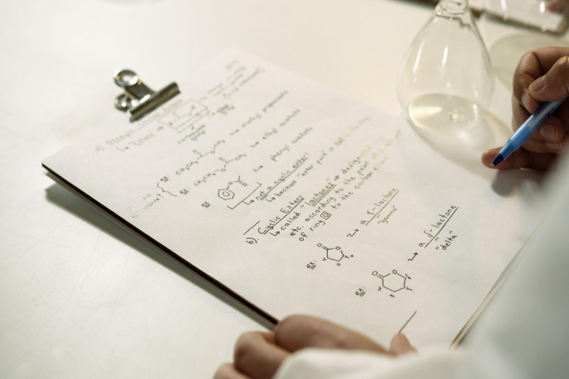 Student reviewing Chemistry questions and chemical structures while preparing for examinations and strengthening problem-solving skills.