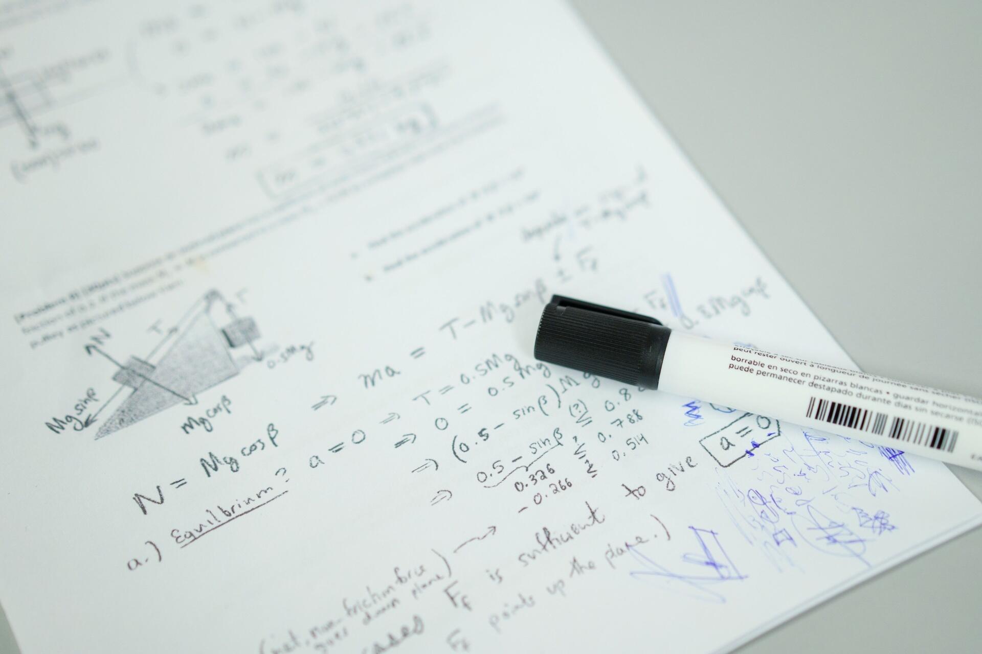 SPM Chemistry revision worksheet featuring calculations, scientific diagrams, handwritten notes, and a marker pen.