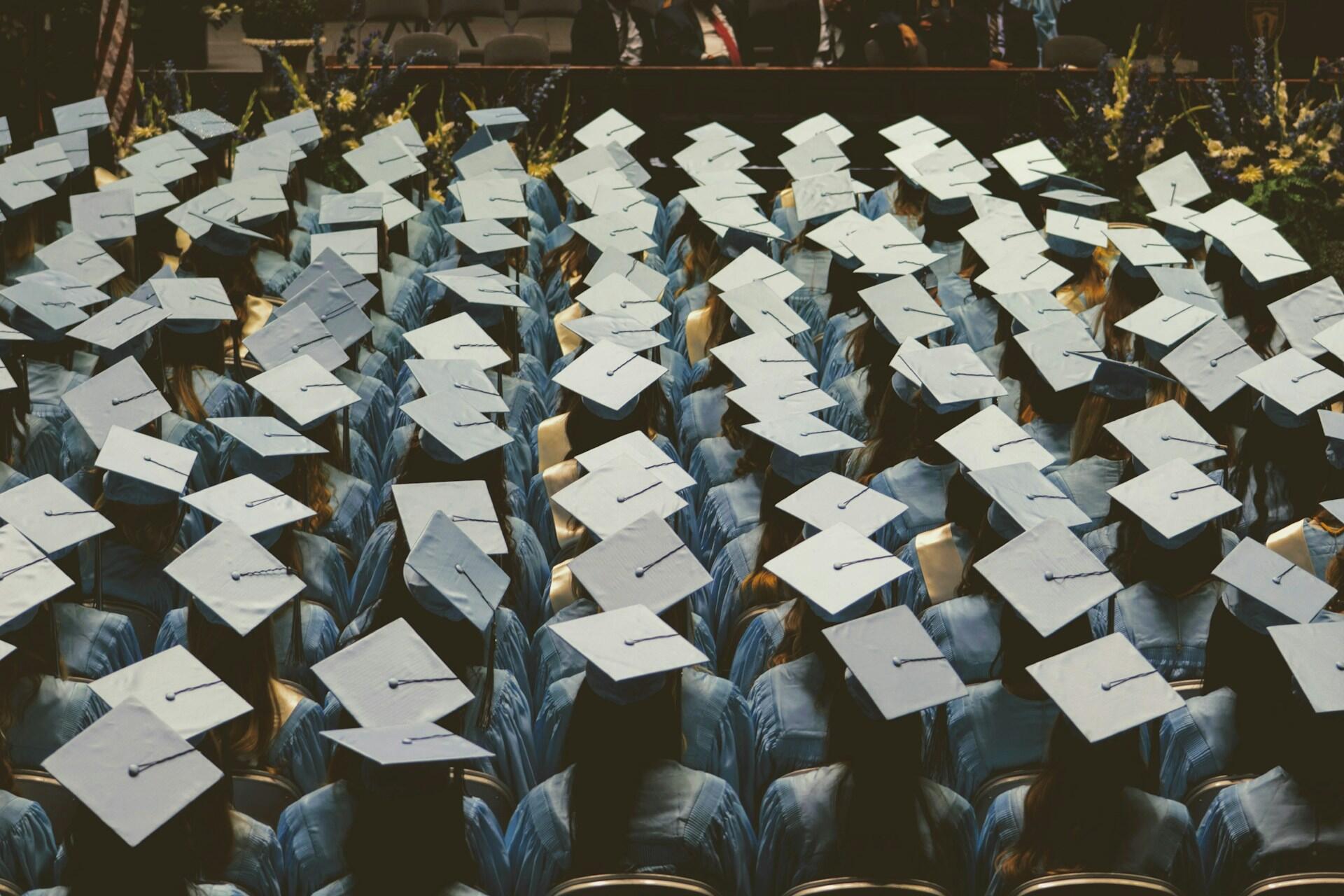 a picture of people wearing graduation caps