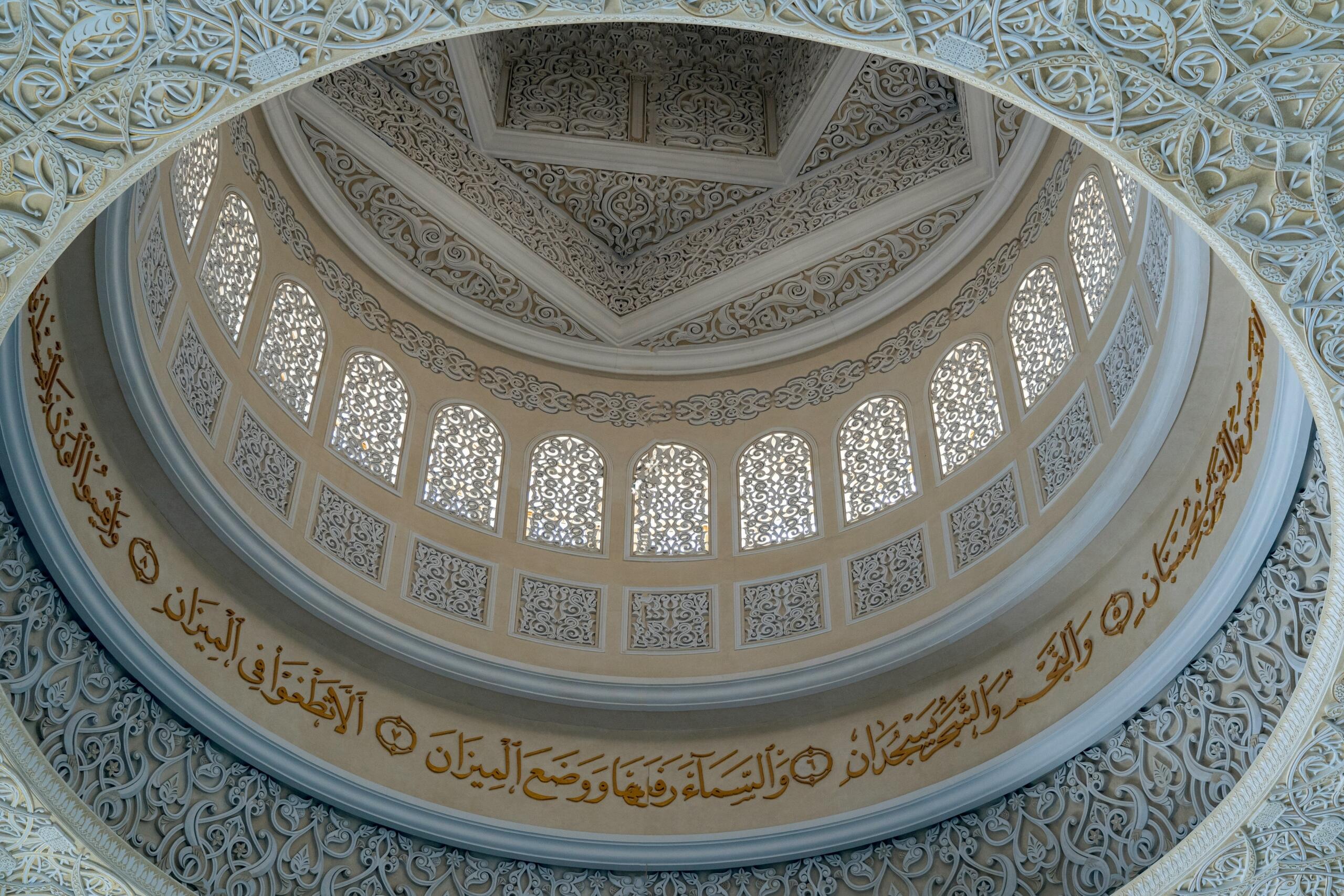 White and brown dome ceiling in a mosque.