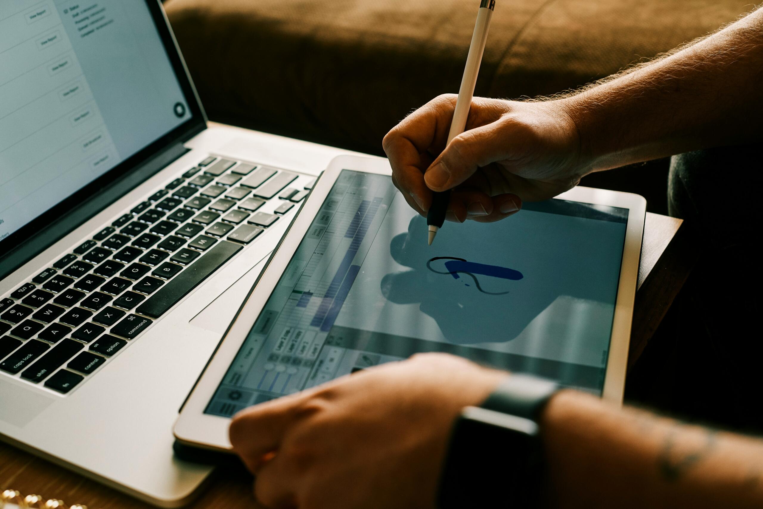 A person designing graphics on their tablet.