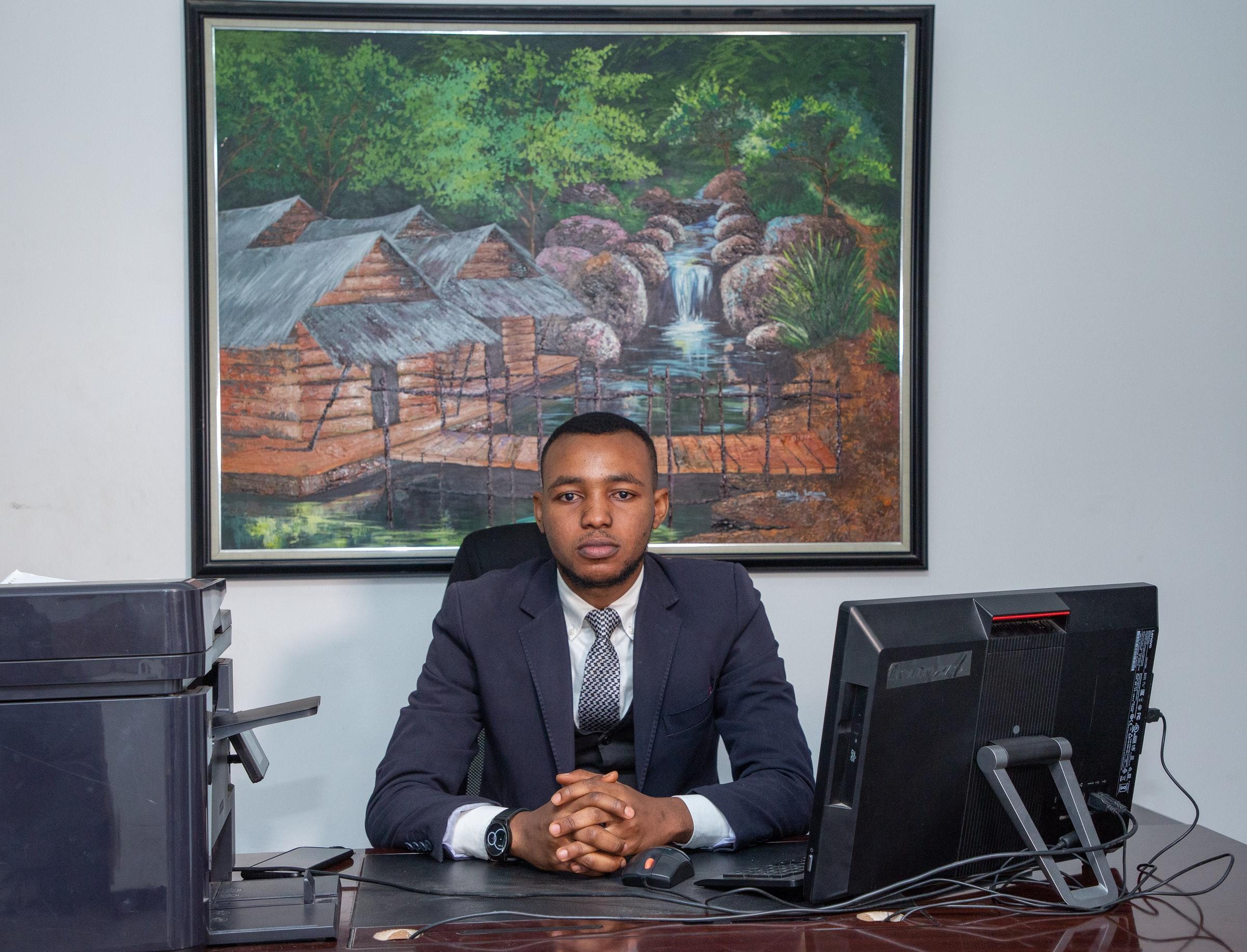 A perosn sitting in front of a computer.