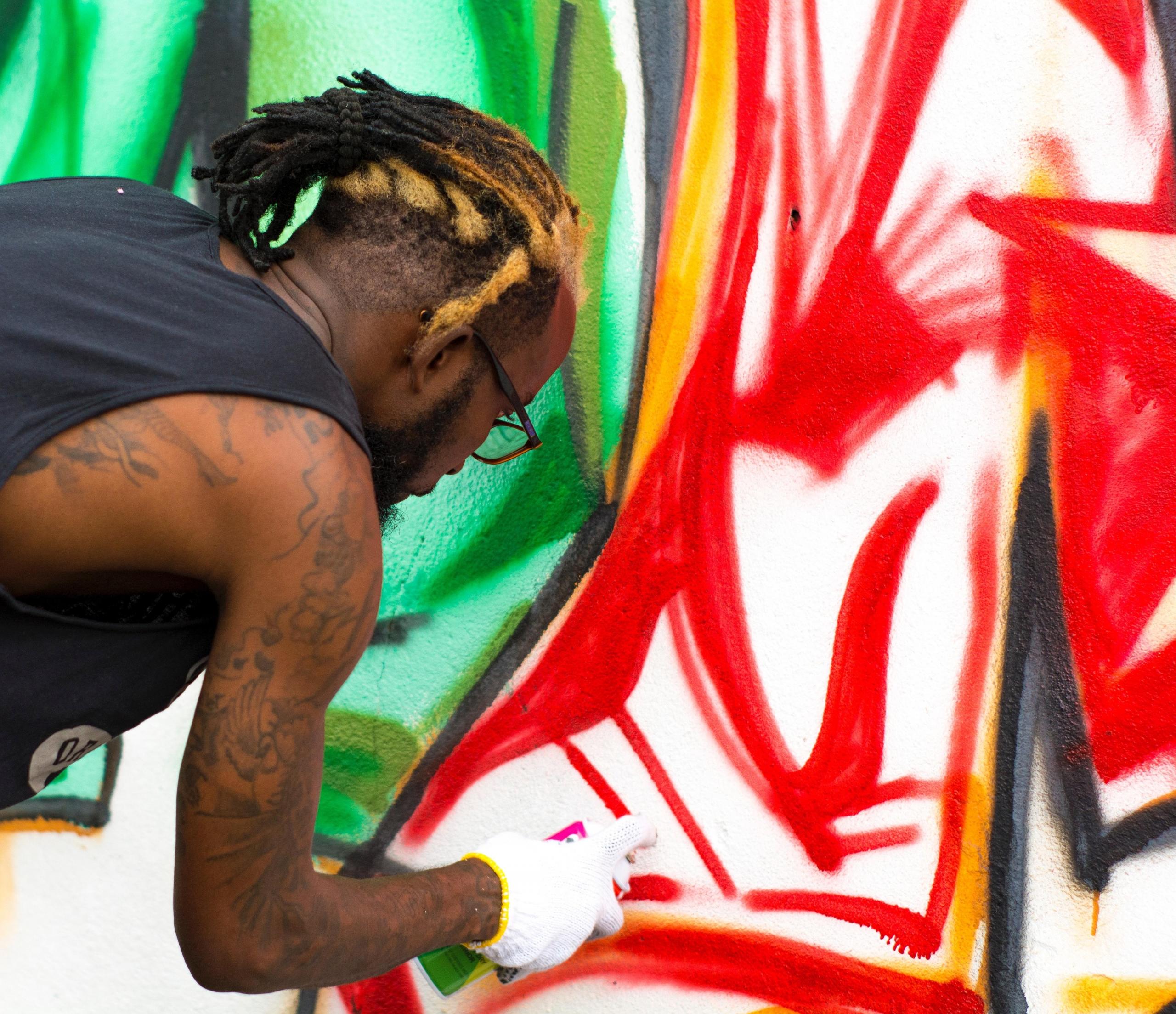 A Nigerian artist painting a portrait