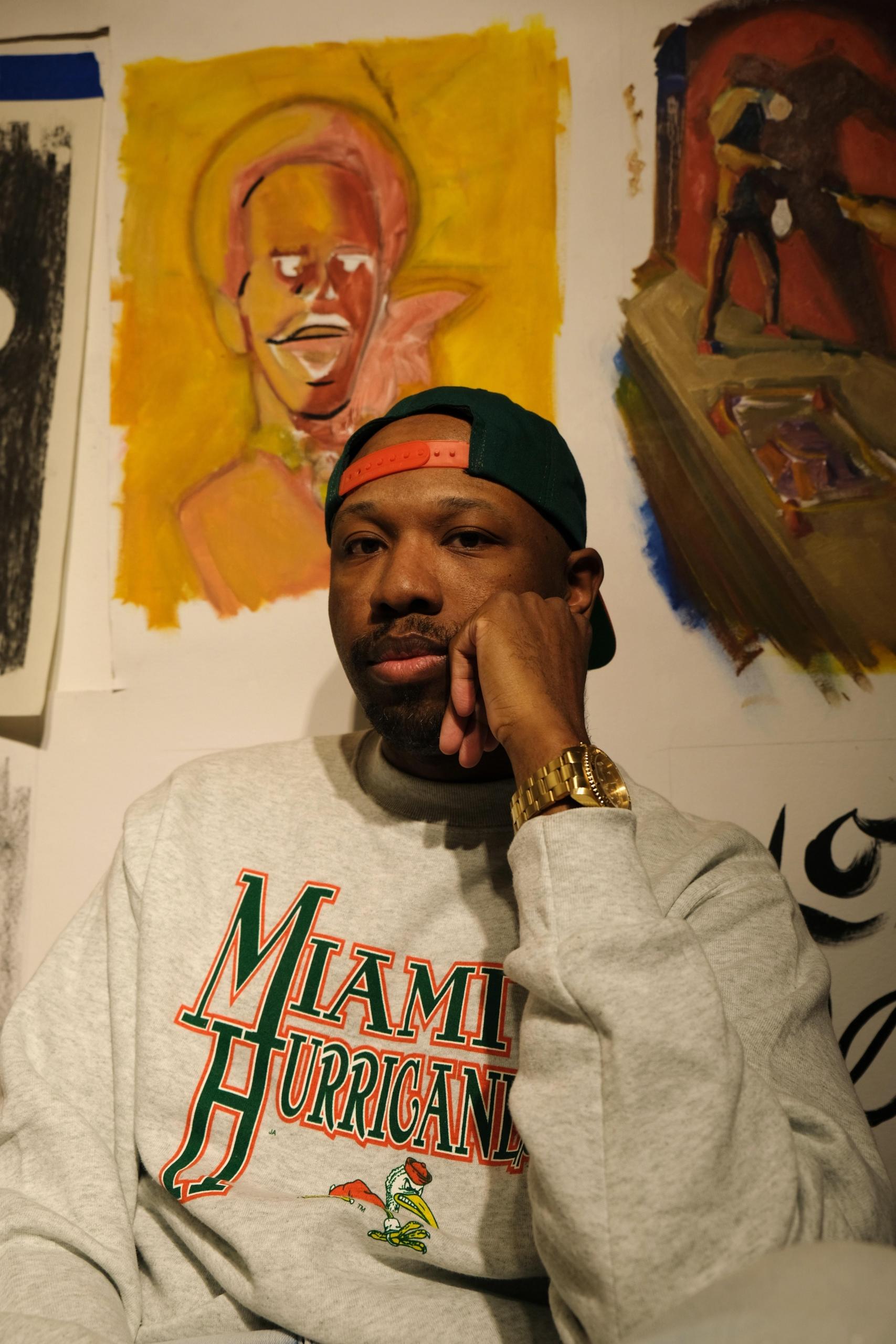 An artist exhibiting his art works.