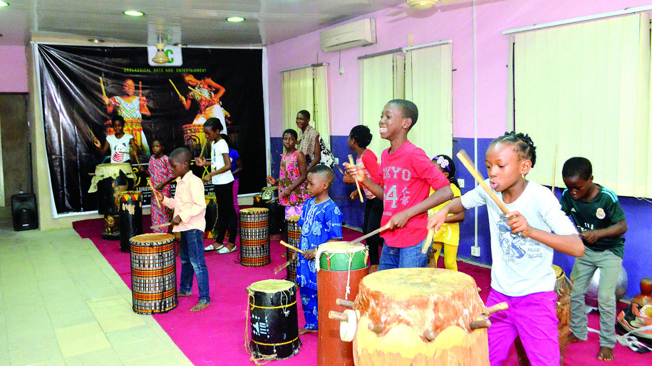 Children learning how to play drums in a drum school in Port Harcourt