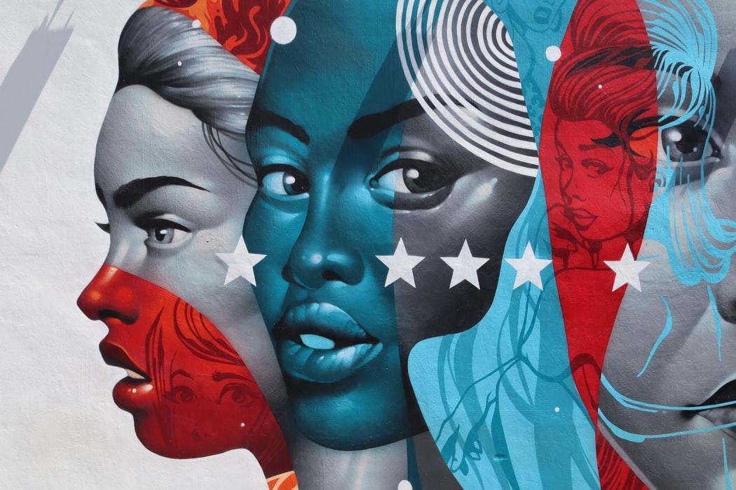 A drawing of ladies with coloured skin.