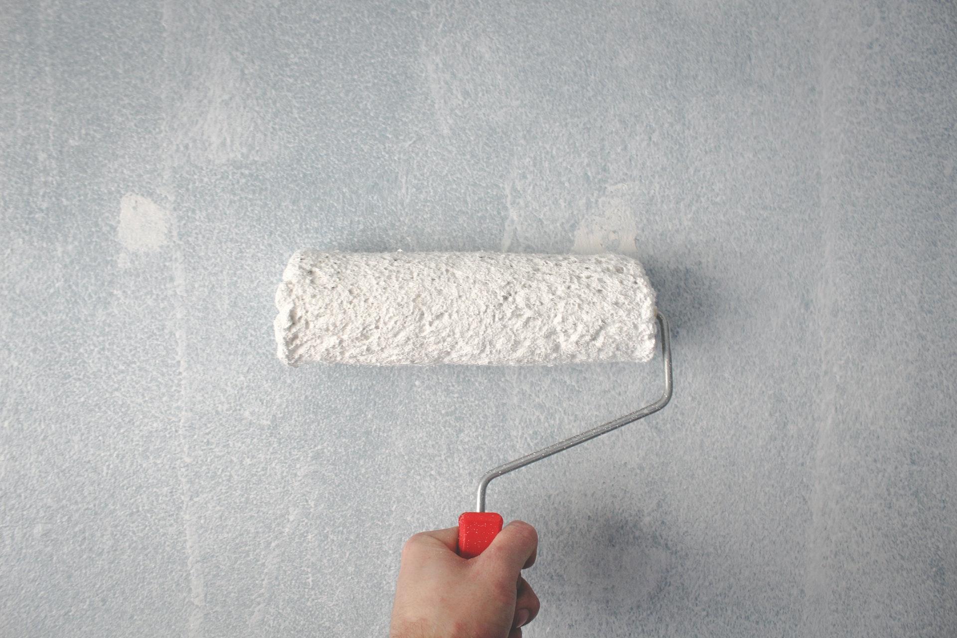 Someone holding a path brush