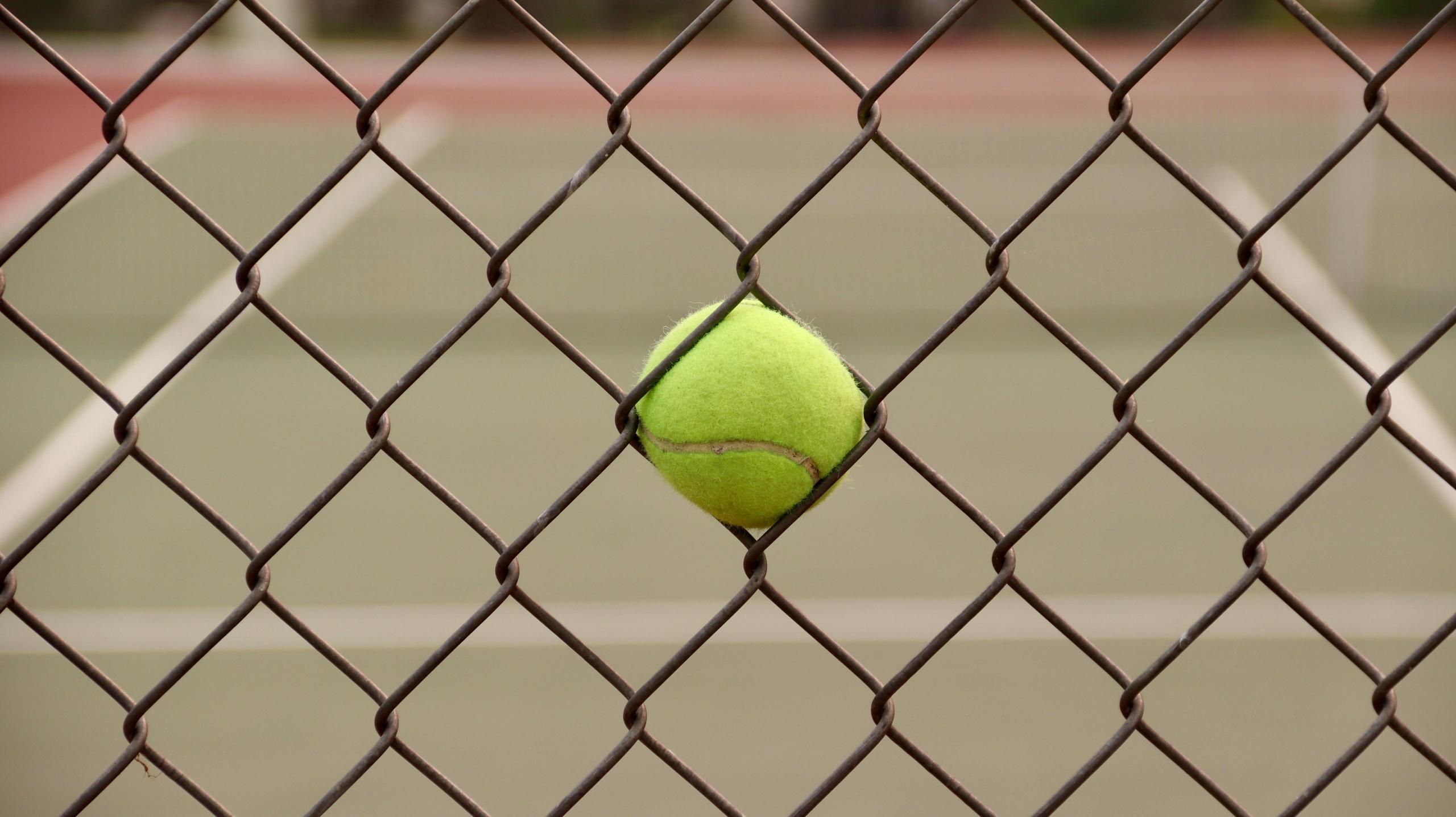 Stuck tennis ball