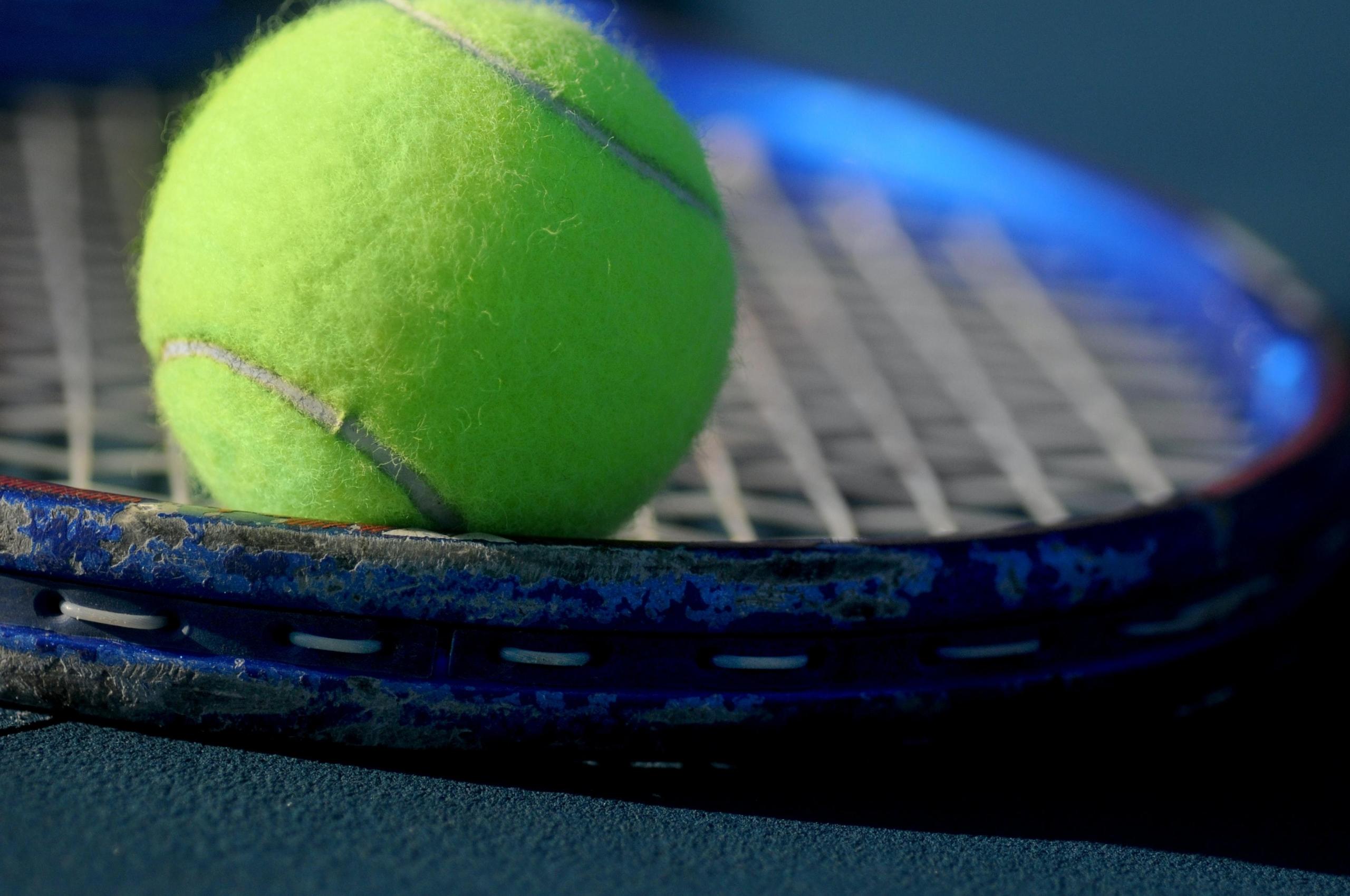 Tennis ball and racket