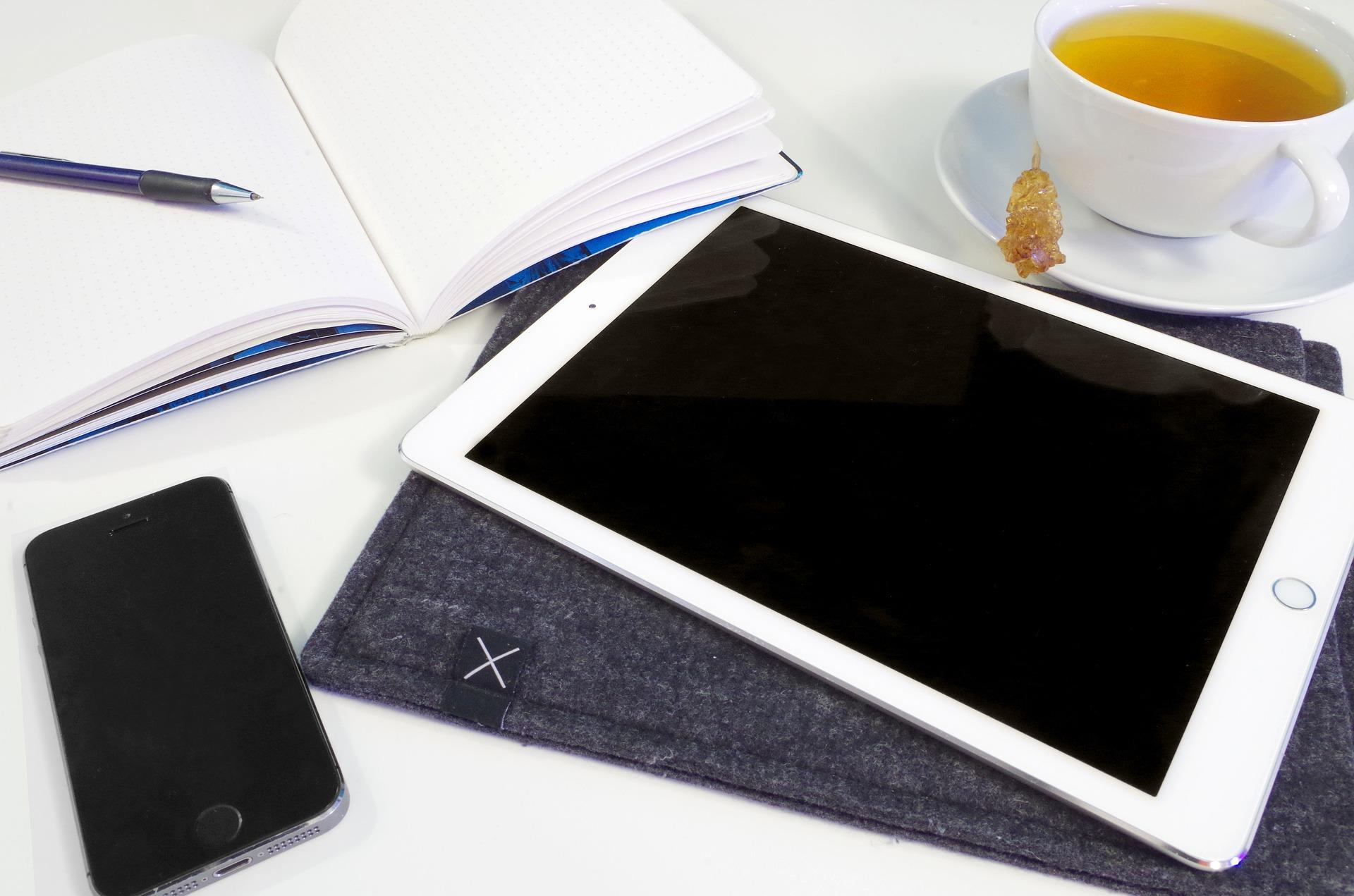 A reading table with mobile communication devices