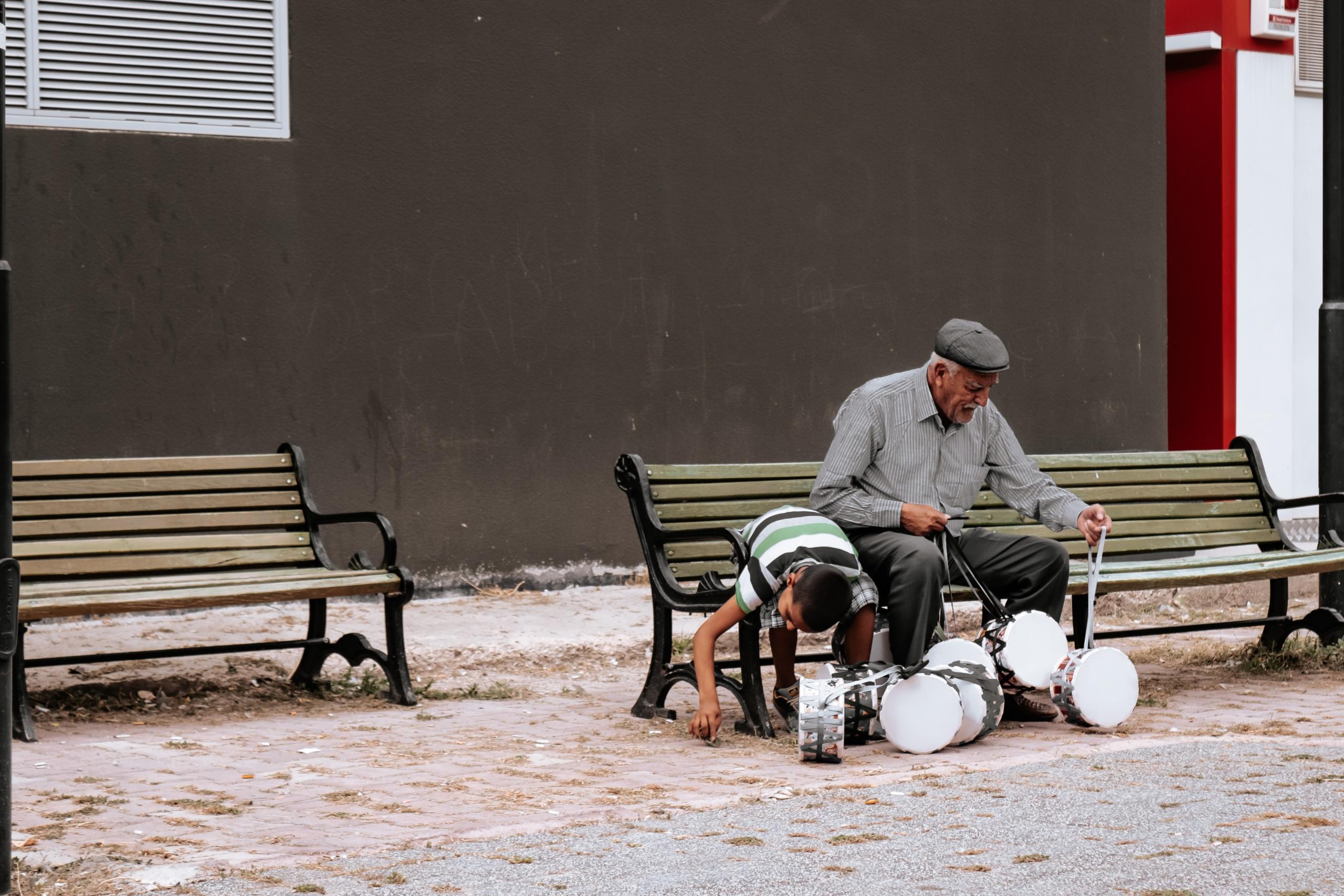 Old man, young boy and drums