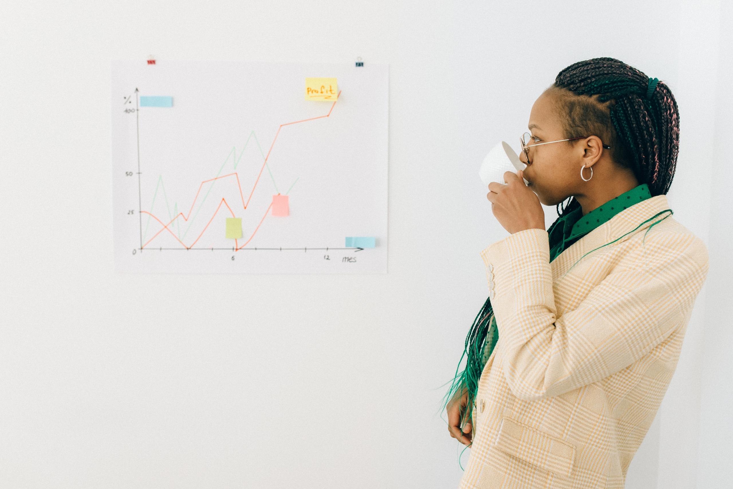 Black woman studying a chart