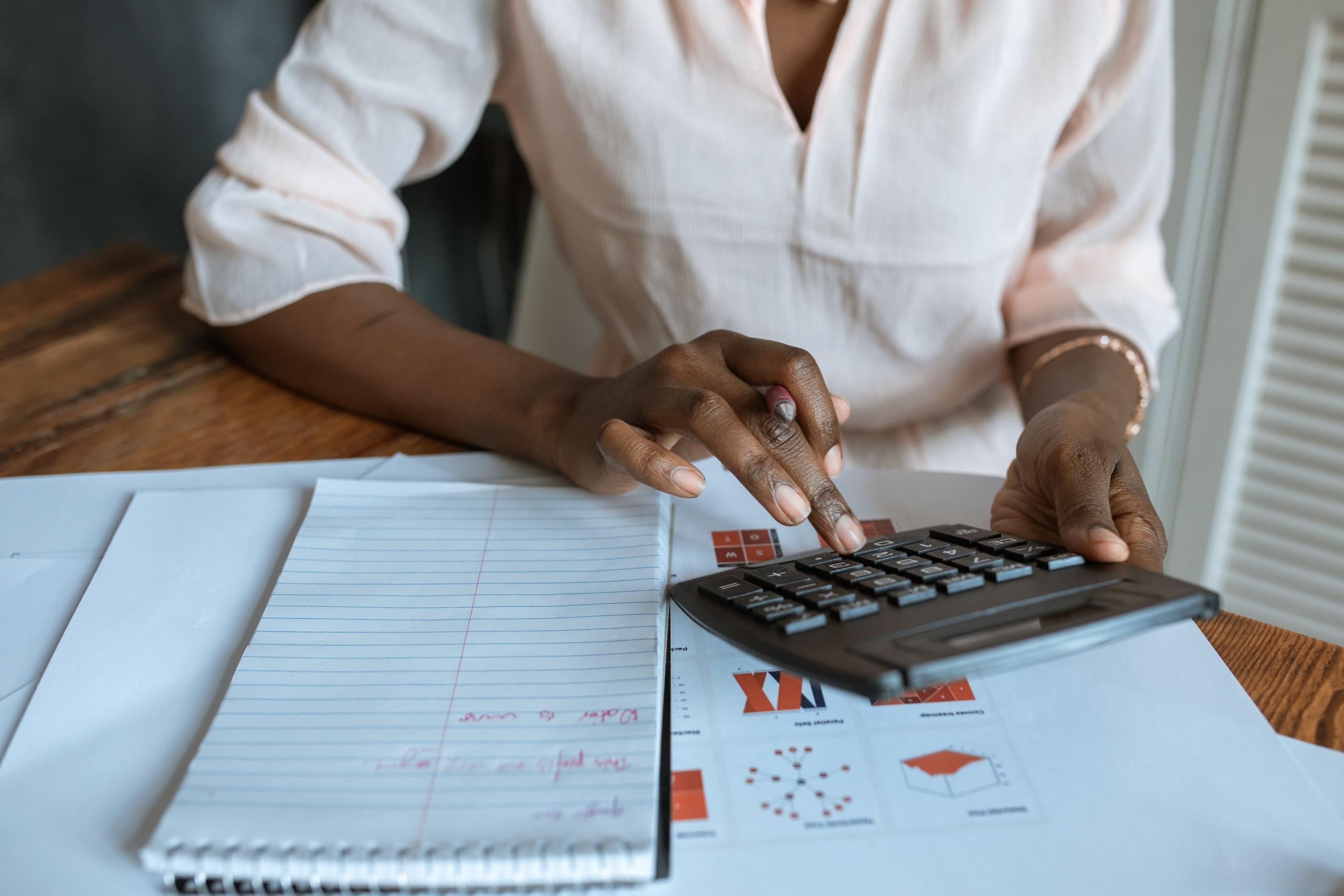 A lady using a calculator