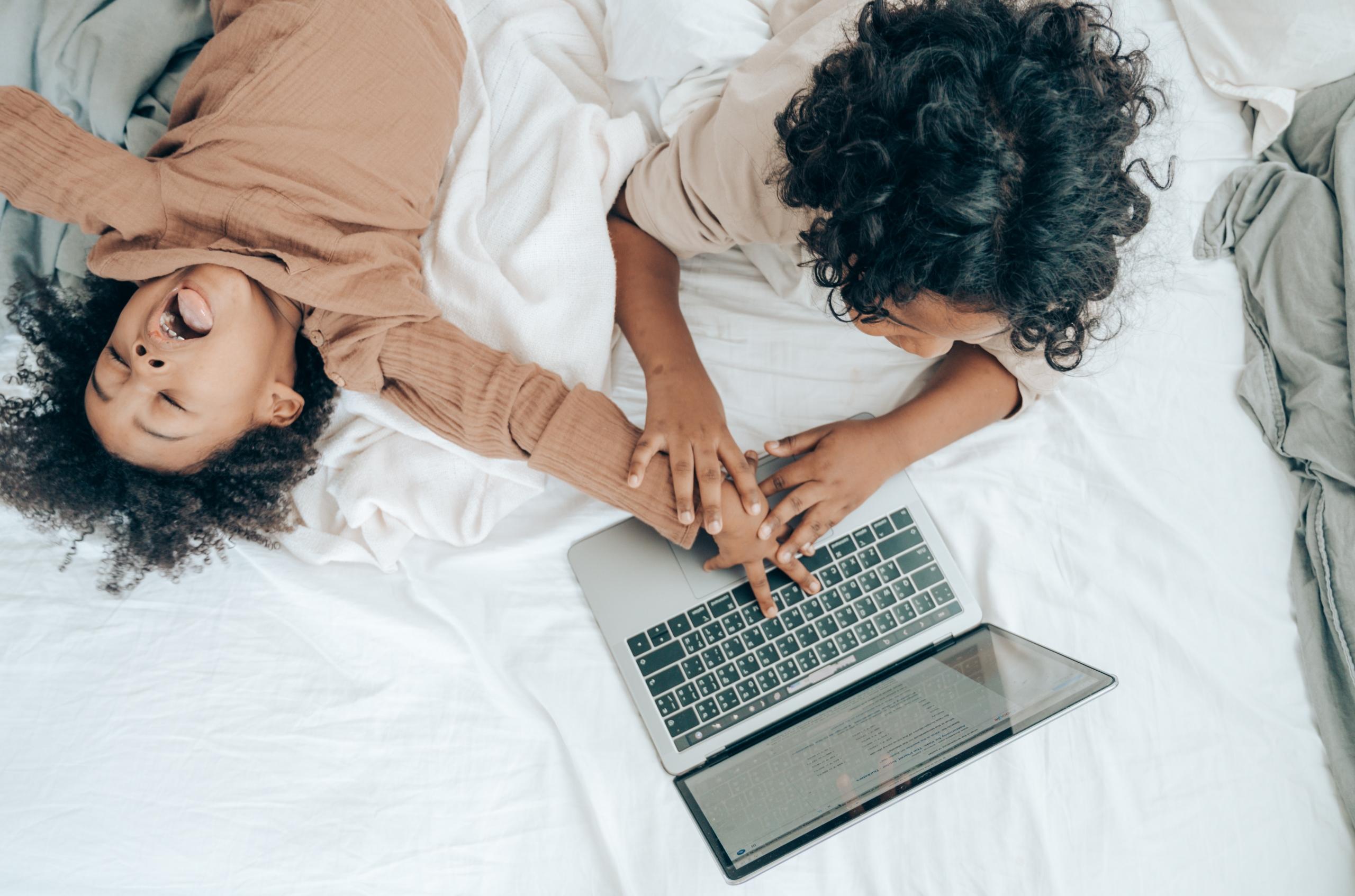 Parent and kid with a laptop