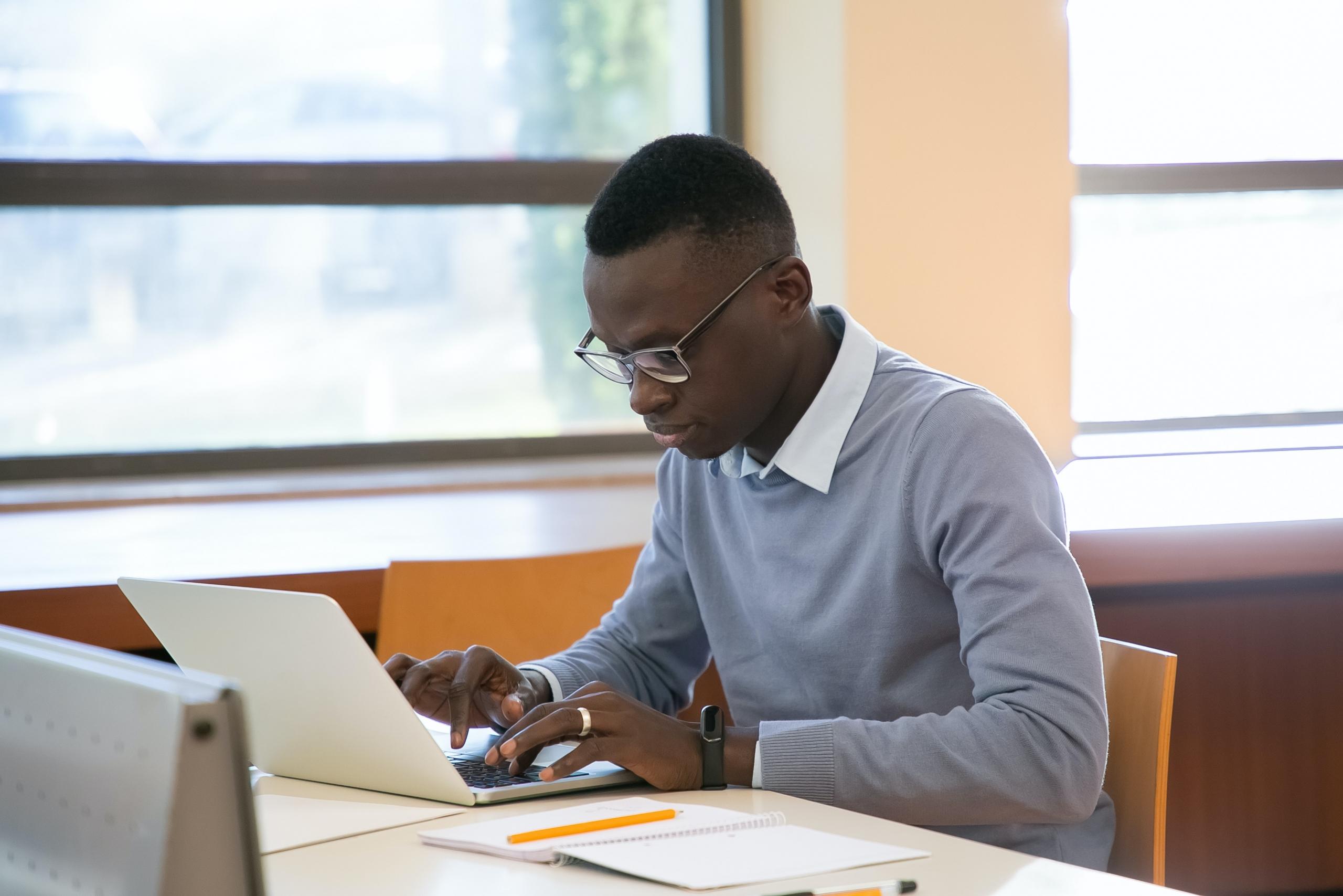A black student with his laptop