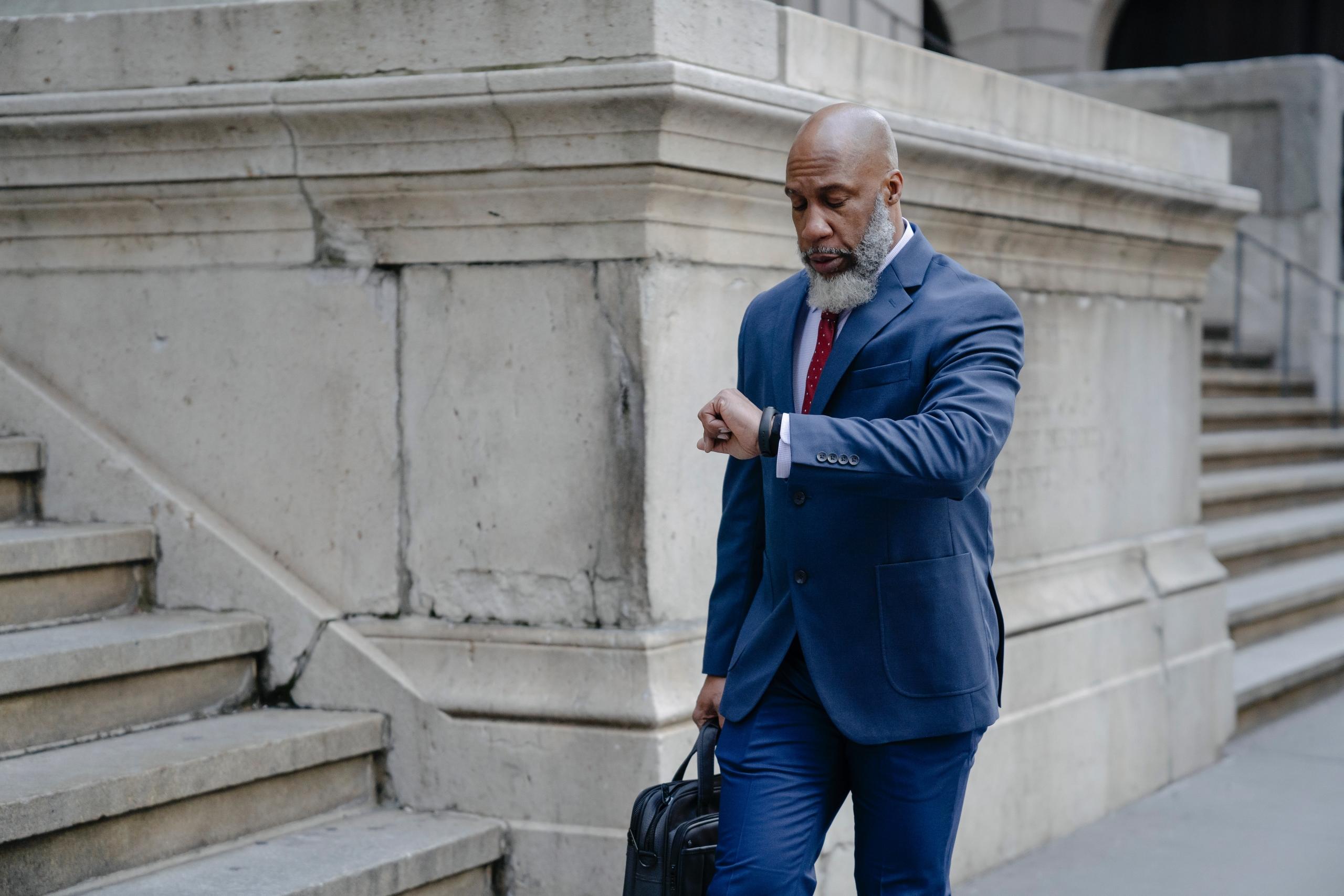 Black man in a suit with briefcase