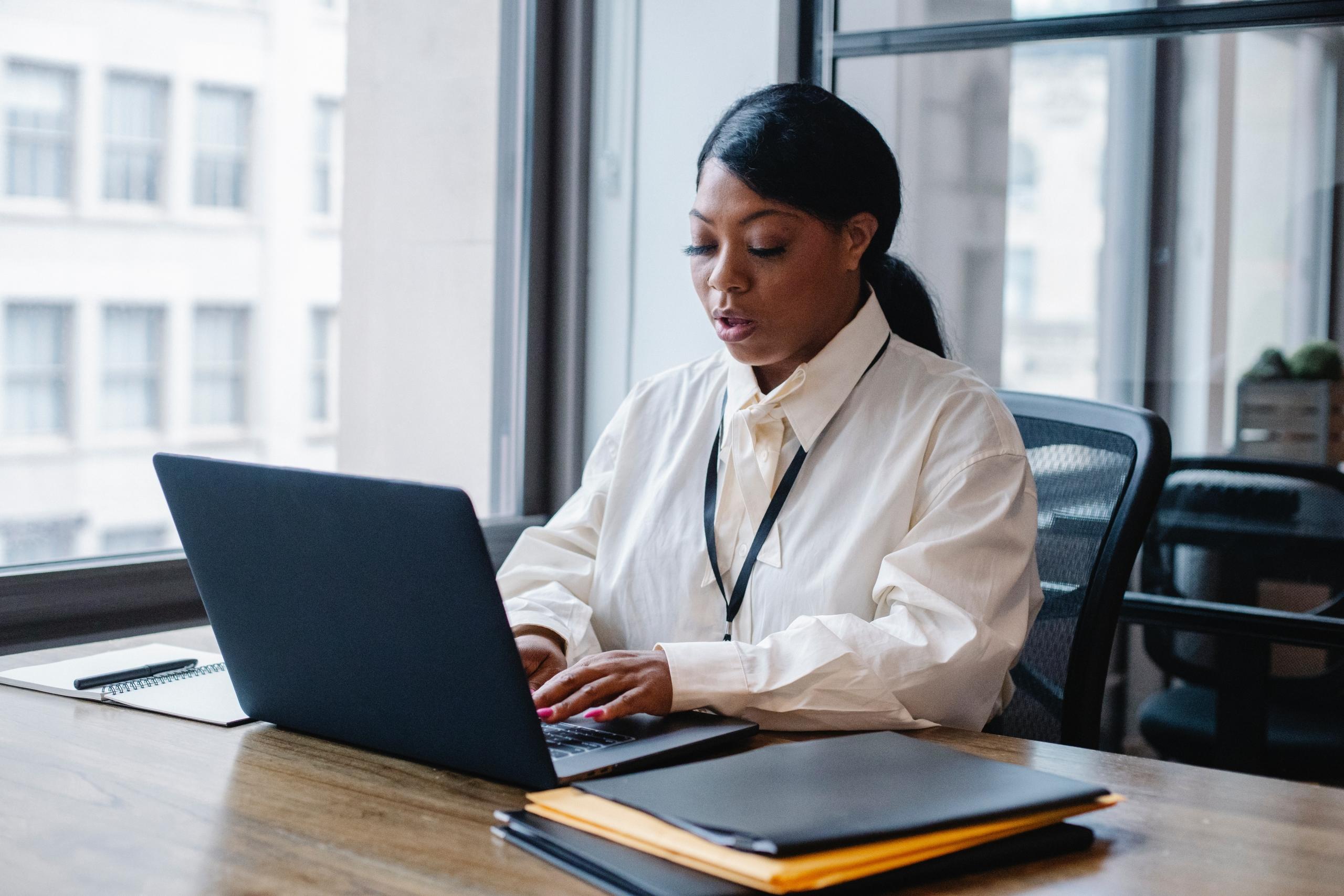 A woman working from her laptop