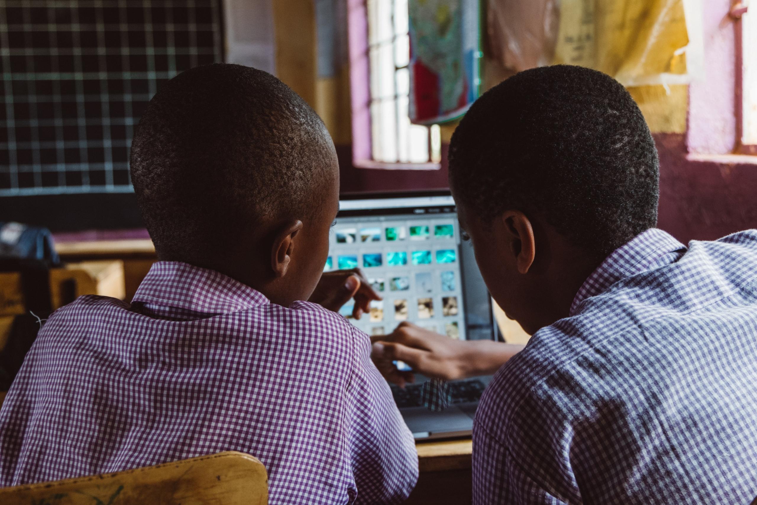 Two kids with a laptop