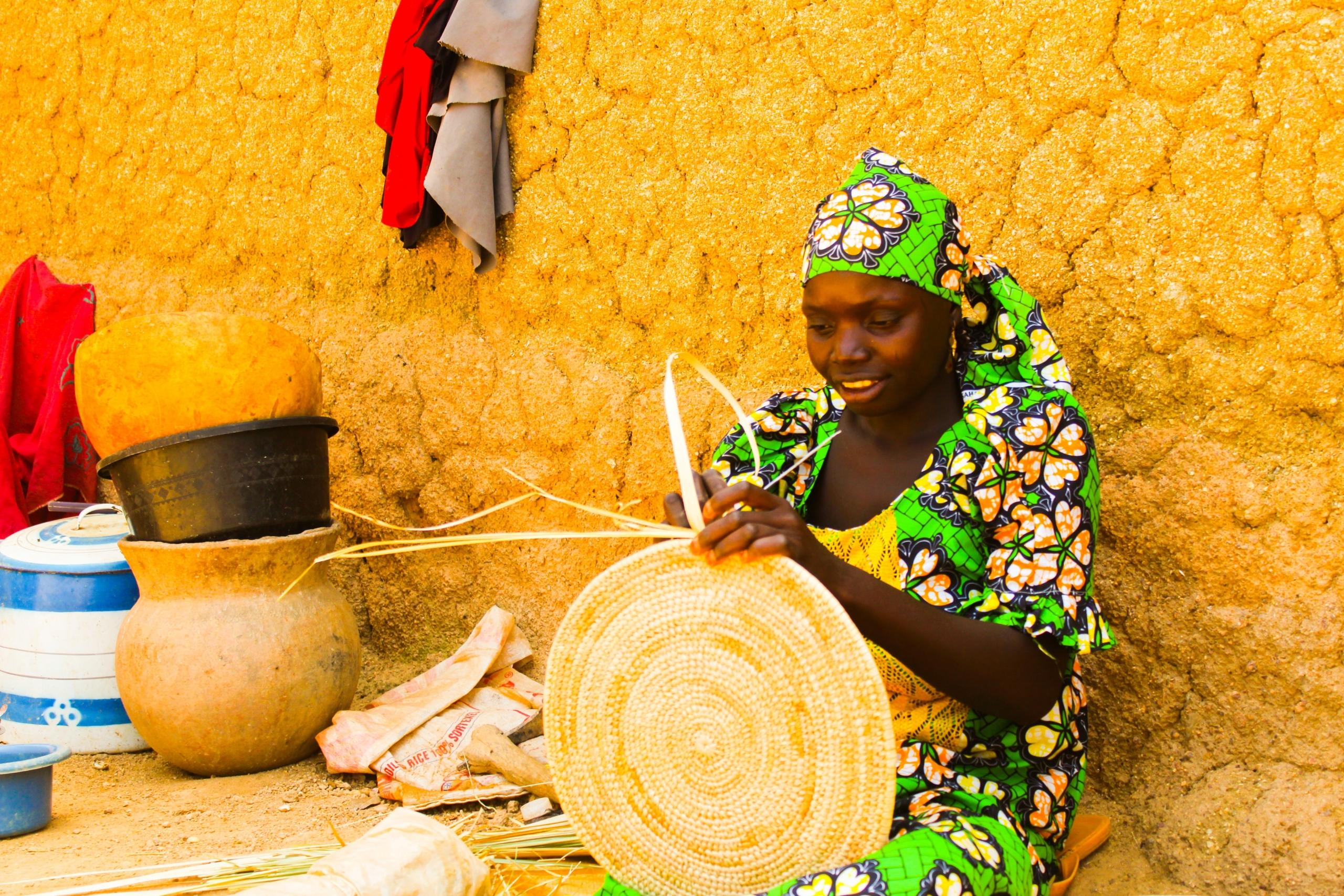 A woman weaving baskets