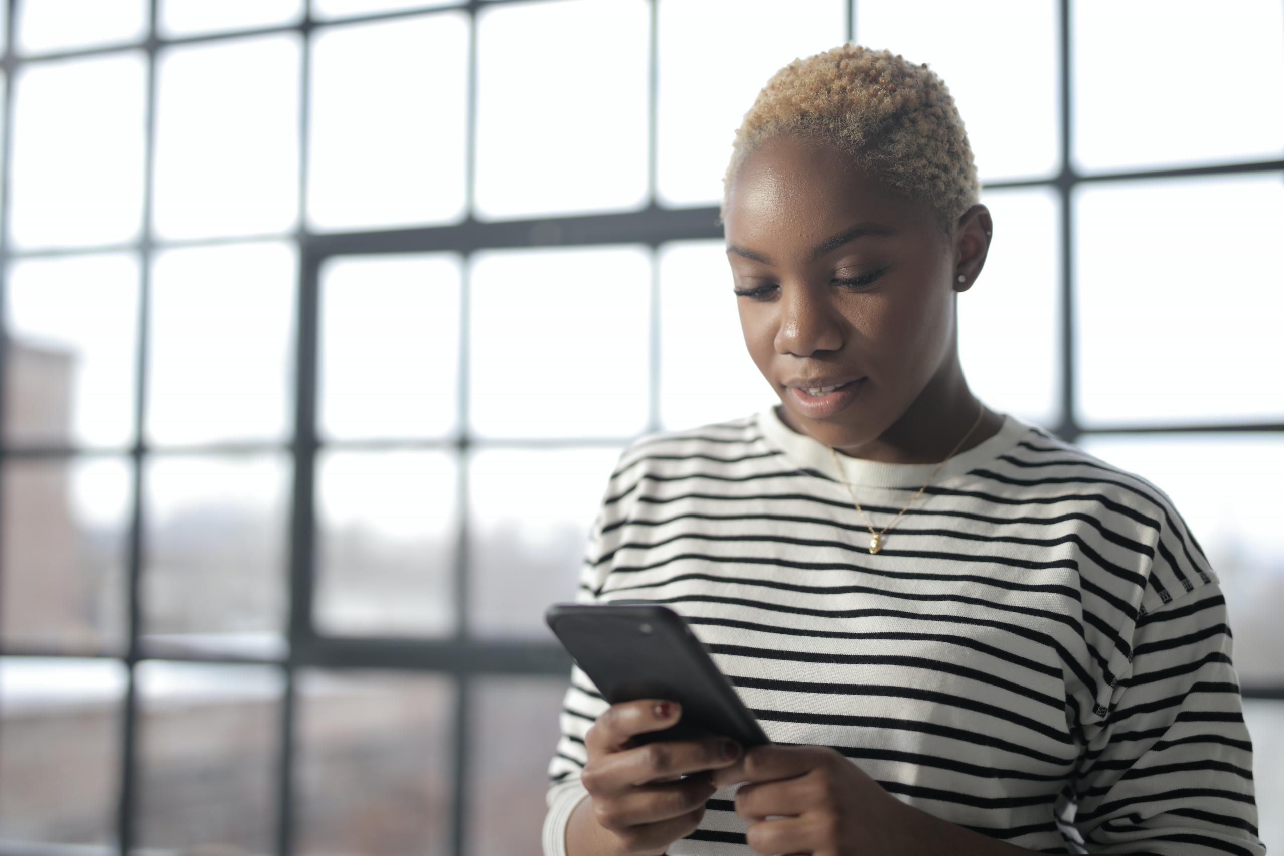 A lady holding her phone