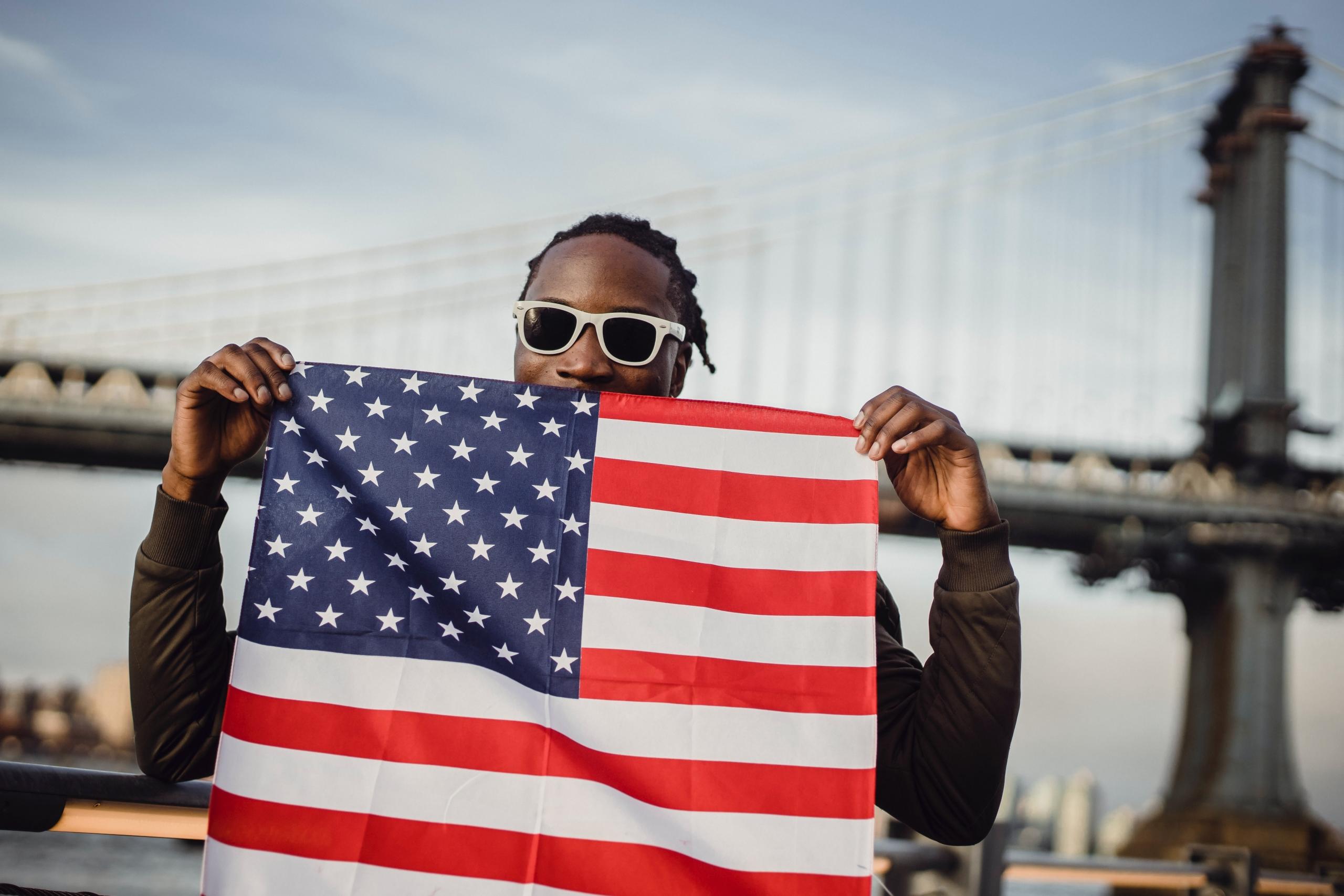 A black man with a US flag