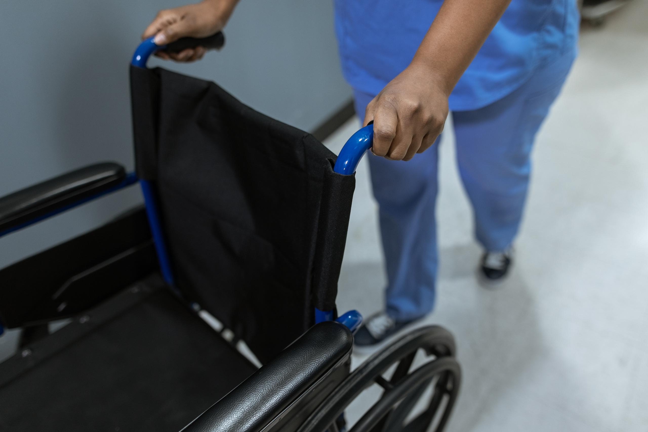 A nurse pushing a wheelchair