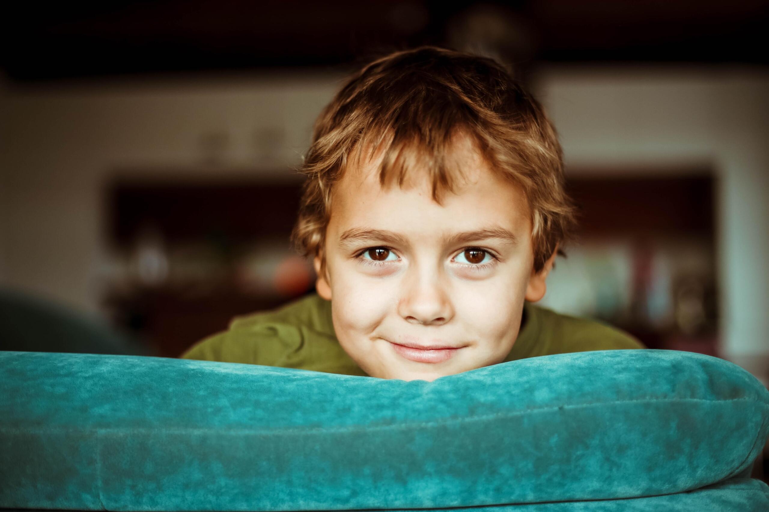 A child smiles at the camera