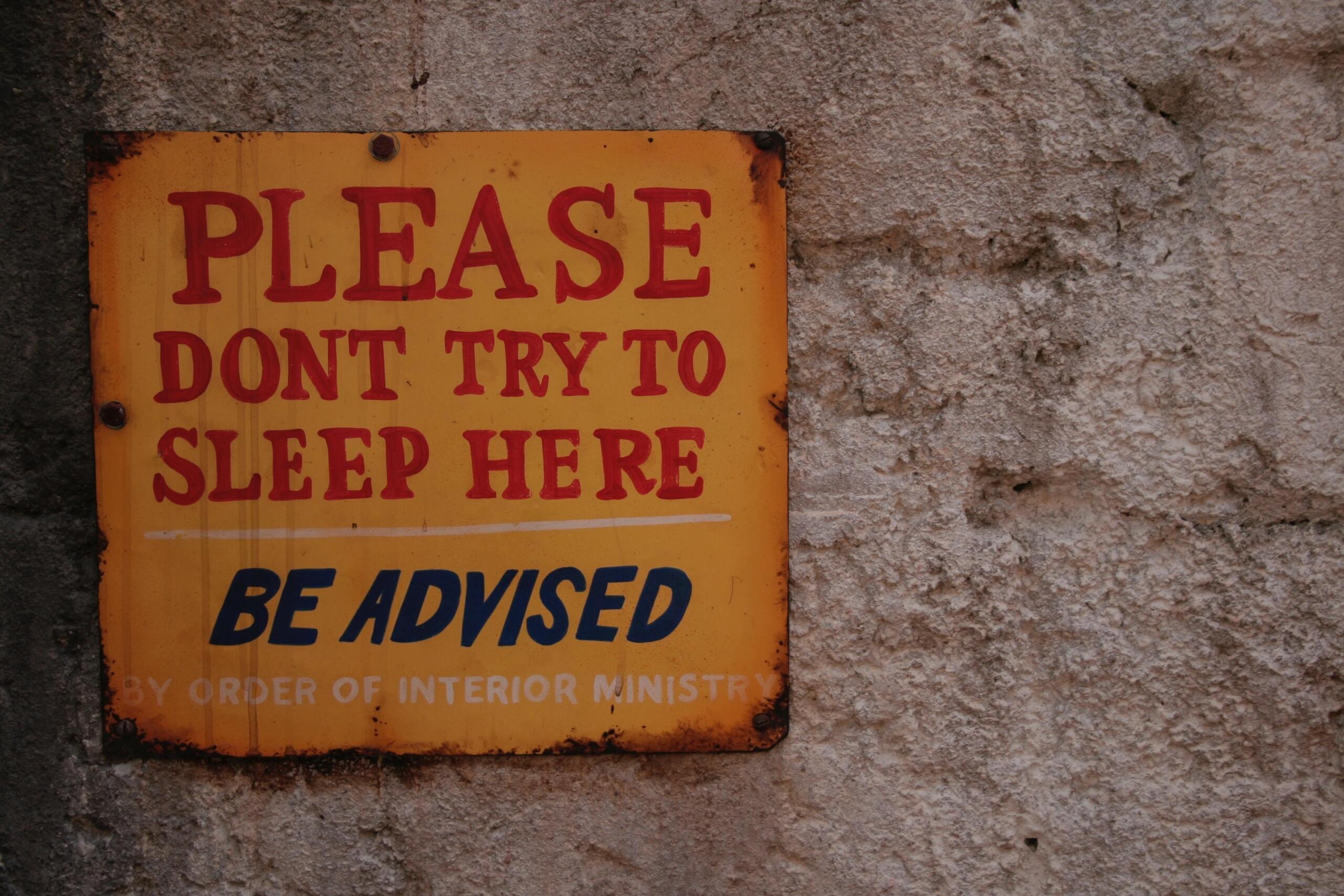 A sign on a bedroom door
