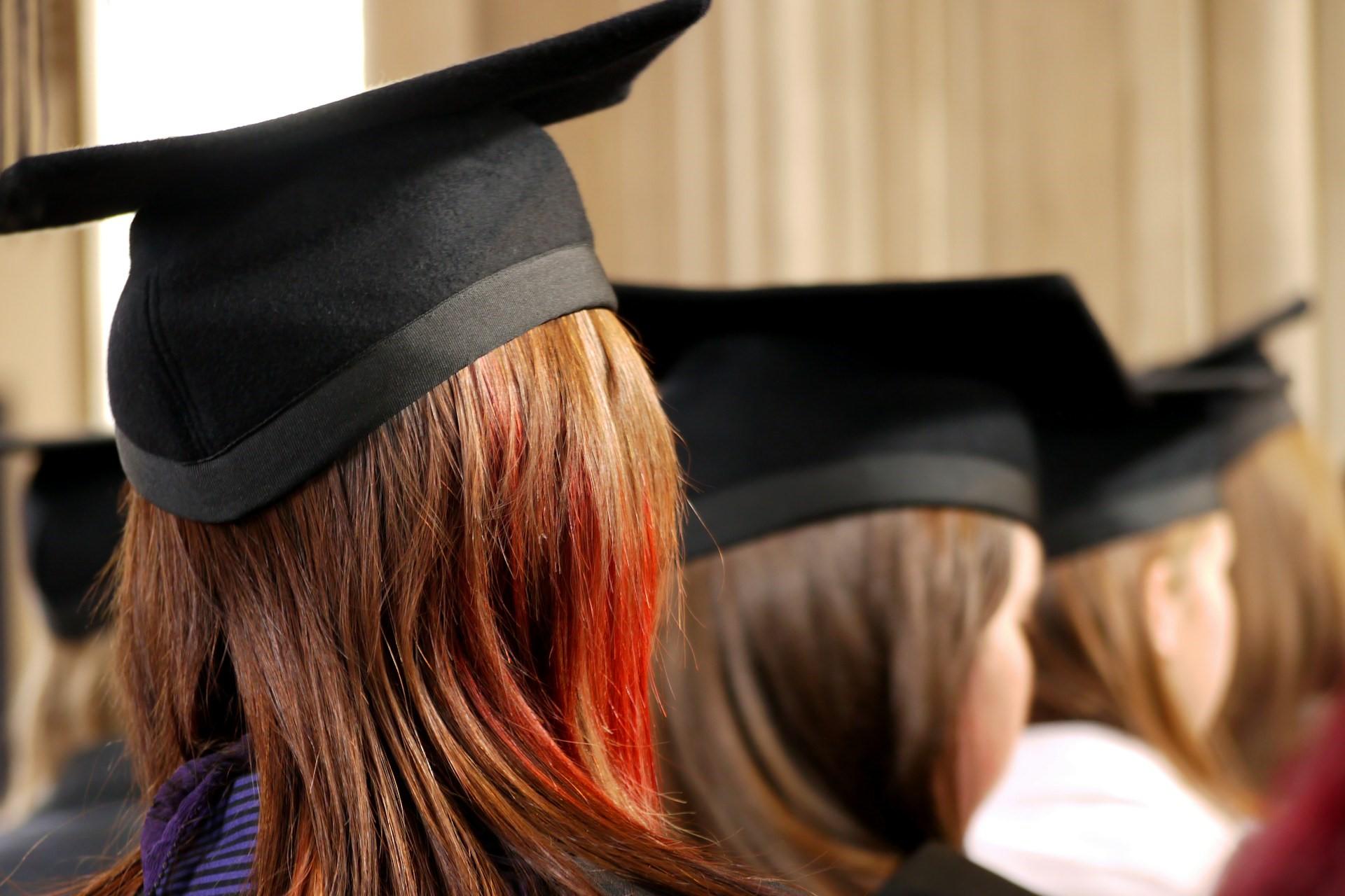 A student wearing a mortarboard at a graduation ceremony.